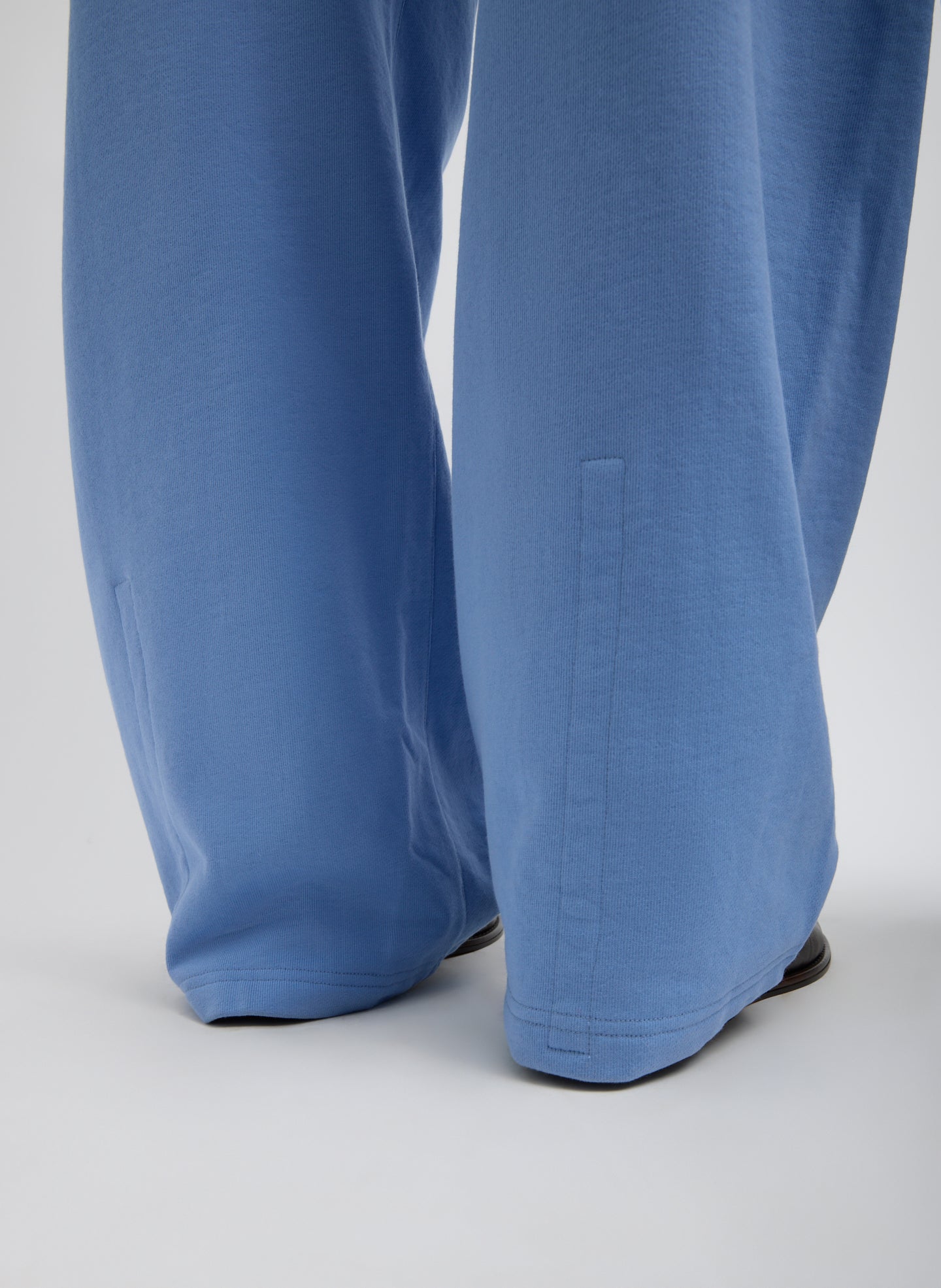 Light Blue Sweatshirting Winslow Pant - closeup of hidden snap details at hem