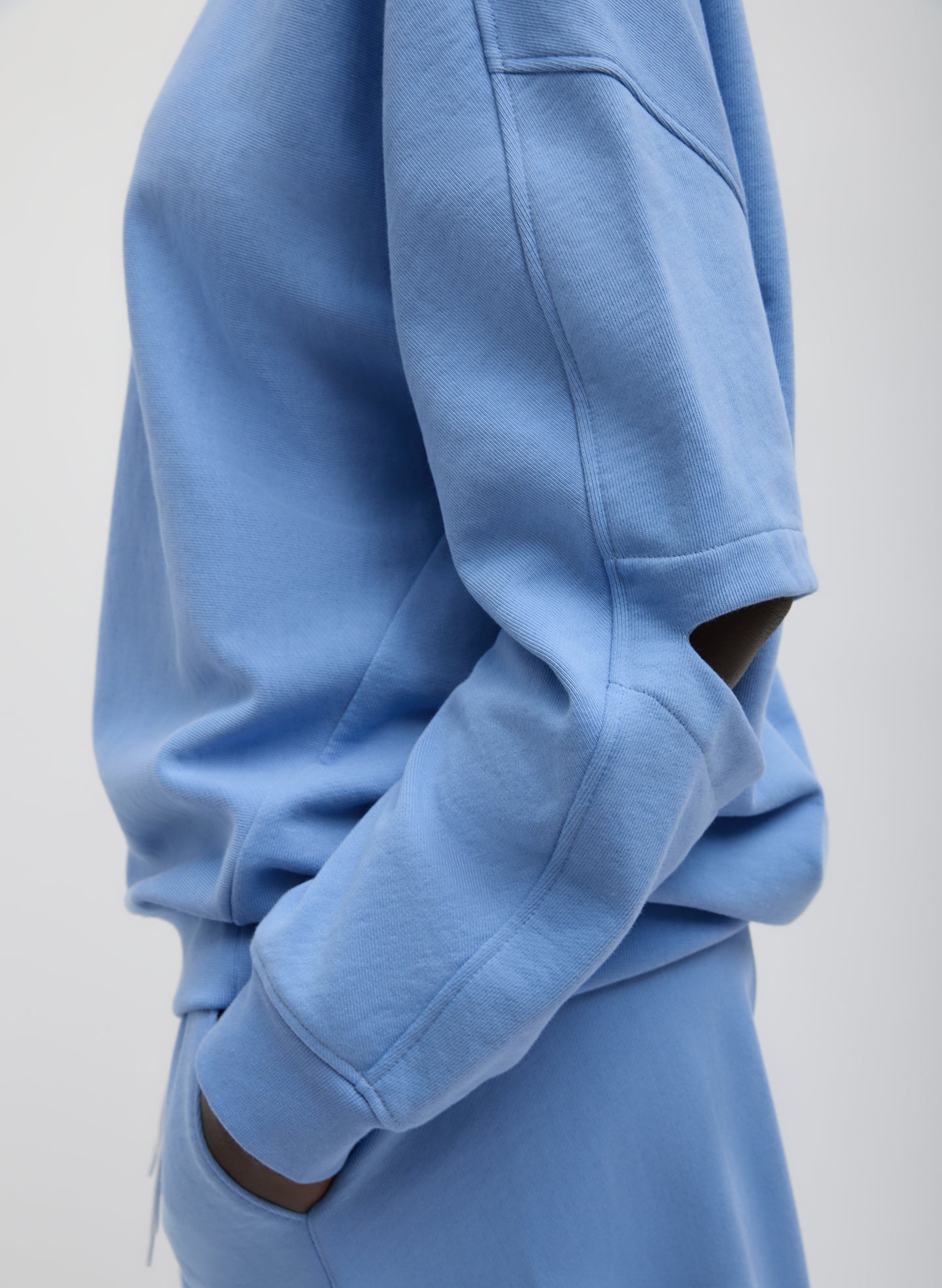 Light Blue Cocoon Crewneck Sweatshirt - closeup of cutout detail at elbow