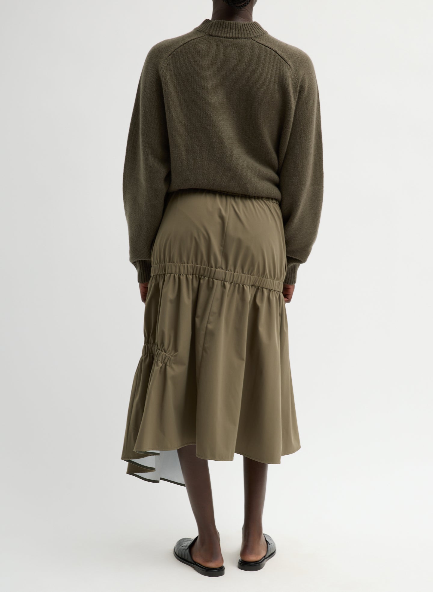 Dark Hazelnut Green Tech Suiting Asymmetrical Skirt - zip up, back view on model