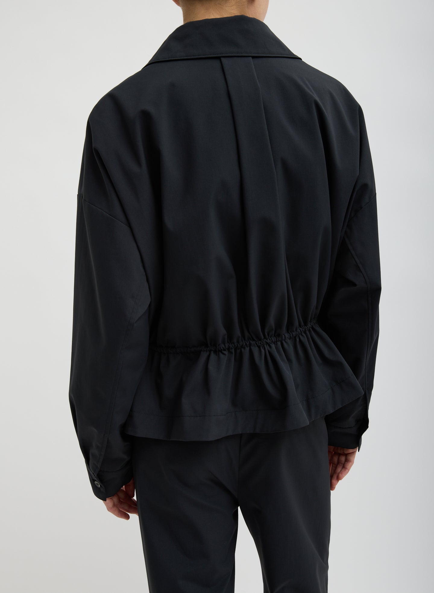 Black Tech Suiting Anorak Bomber - video on model - back view on model