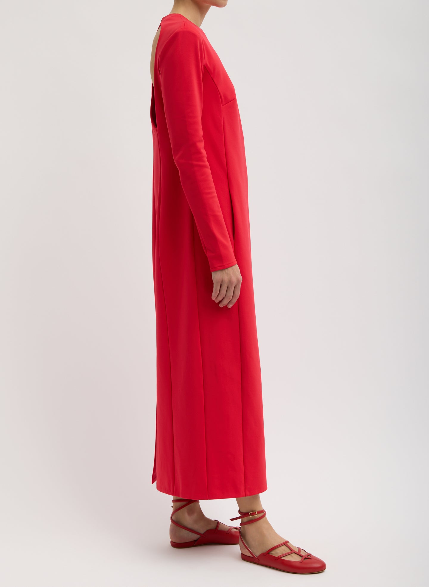 Red Compact Ultra Stretch Knit Dress With Cut Out Back - long sleeve maxi dress, side view on model