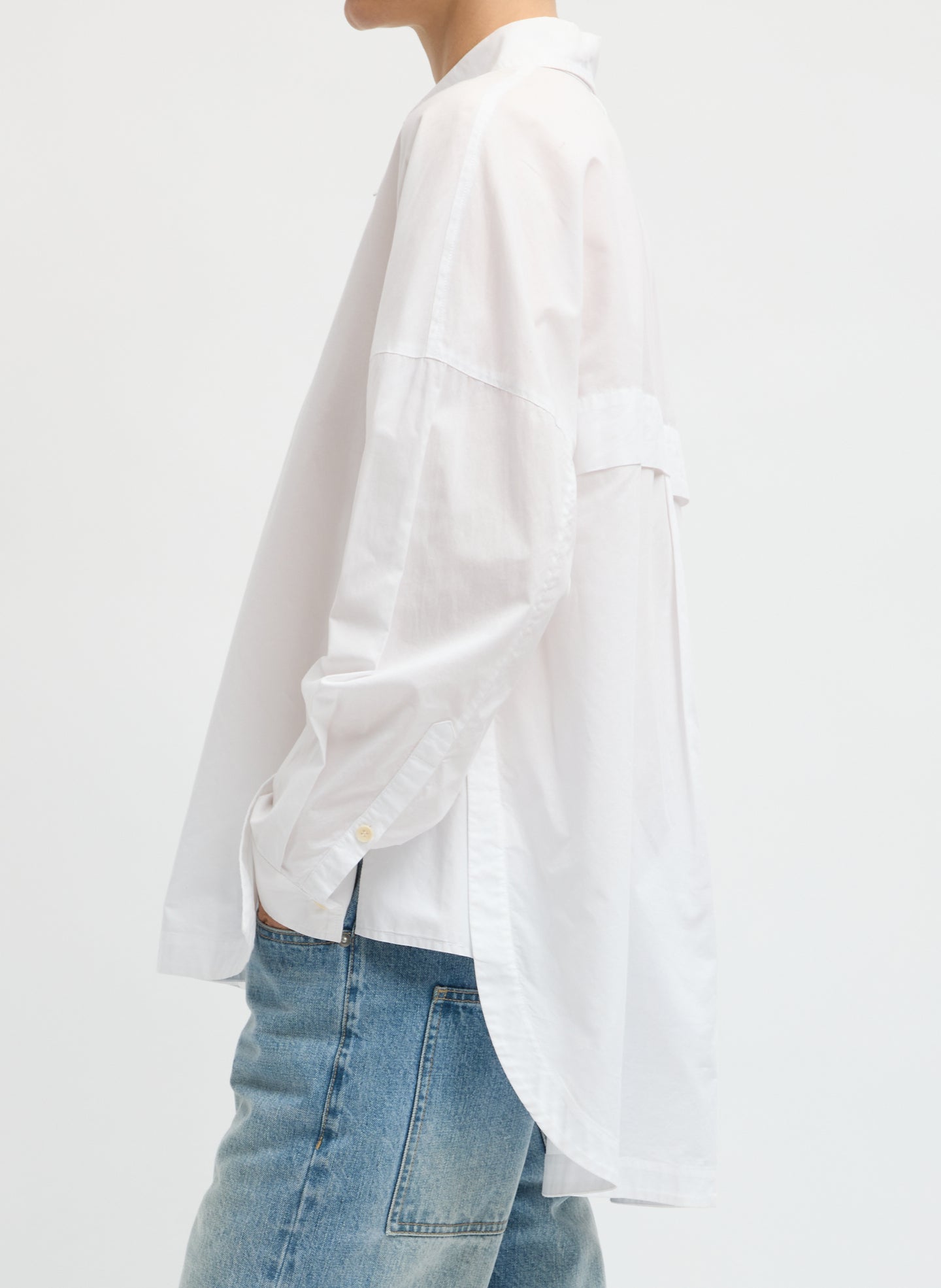 White Gabe Shirt - oversized button down top, side view on model