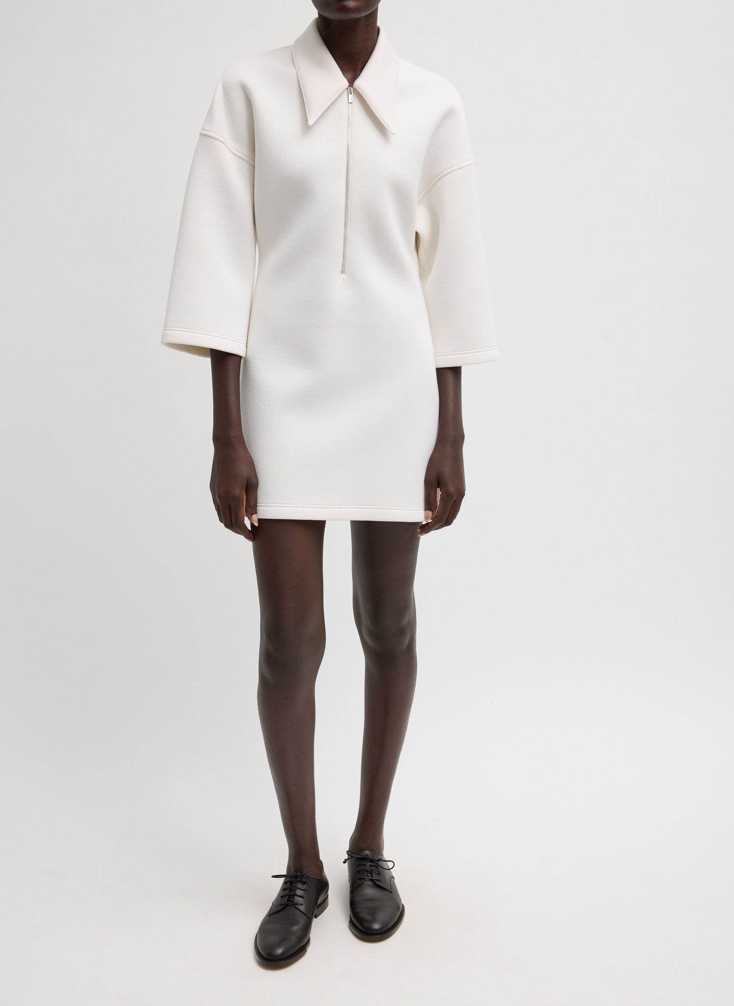 Bonded Viscose Zip Front Short Sleeve Slim Tunic - Ivory Bonded Viscose Zip Front Short Sleeve Slim Tunic - front view on model