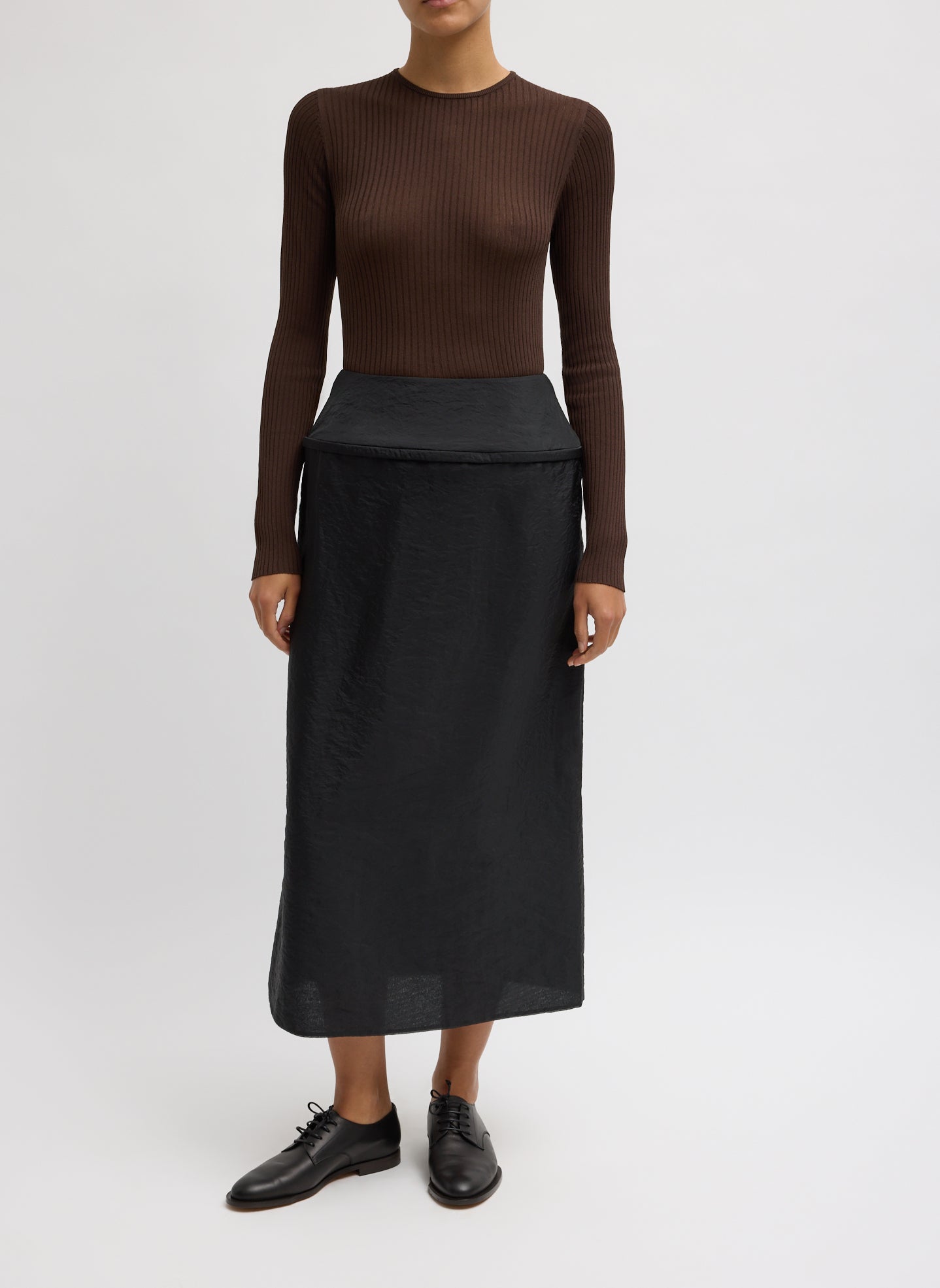 Chassis Hoop Pencil Skirt - Black Chassis Hoop Pencil Skirt - midi skirt with hoop insert at waist, front view on model