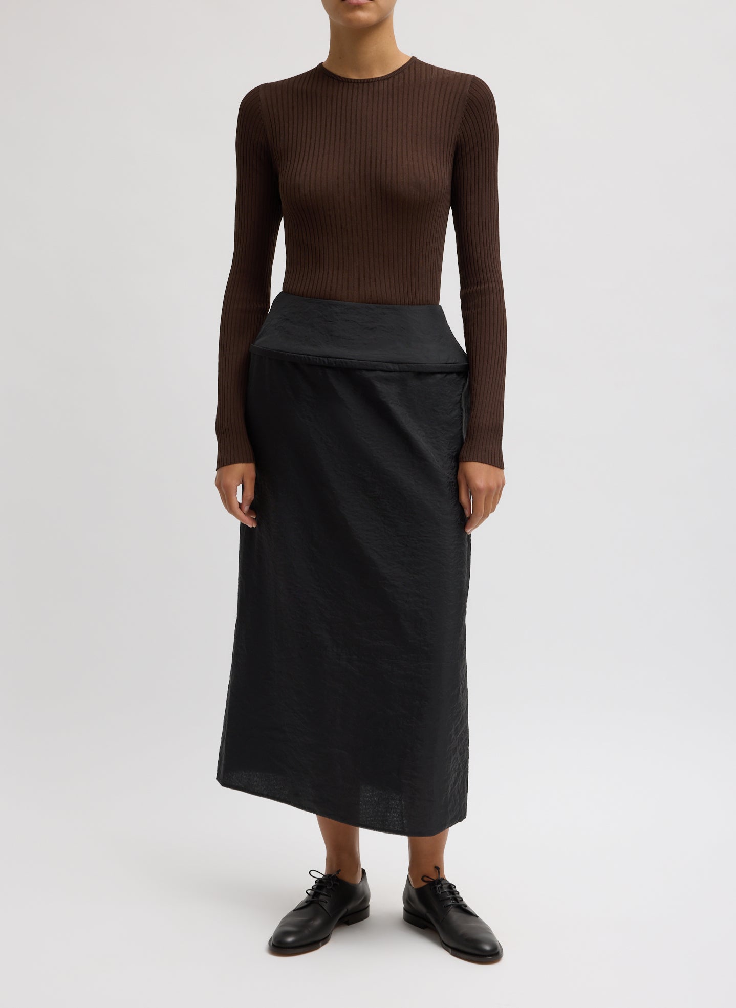 Black Chassis Hoop Pencil Skirt - midi skirt with hoop insert at waist, front view on model
