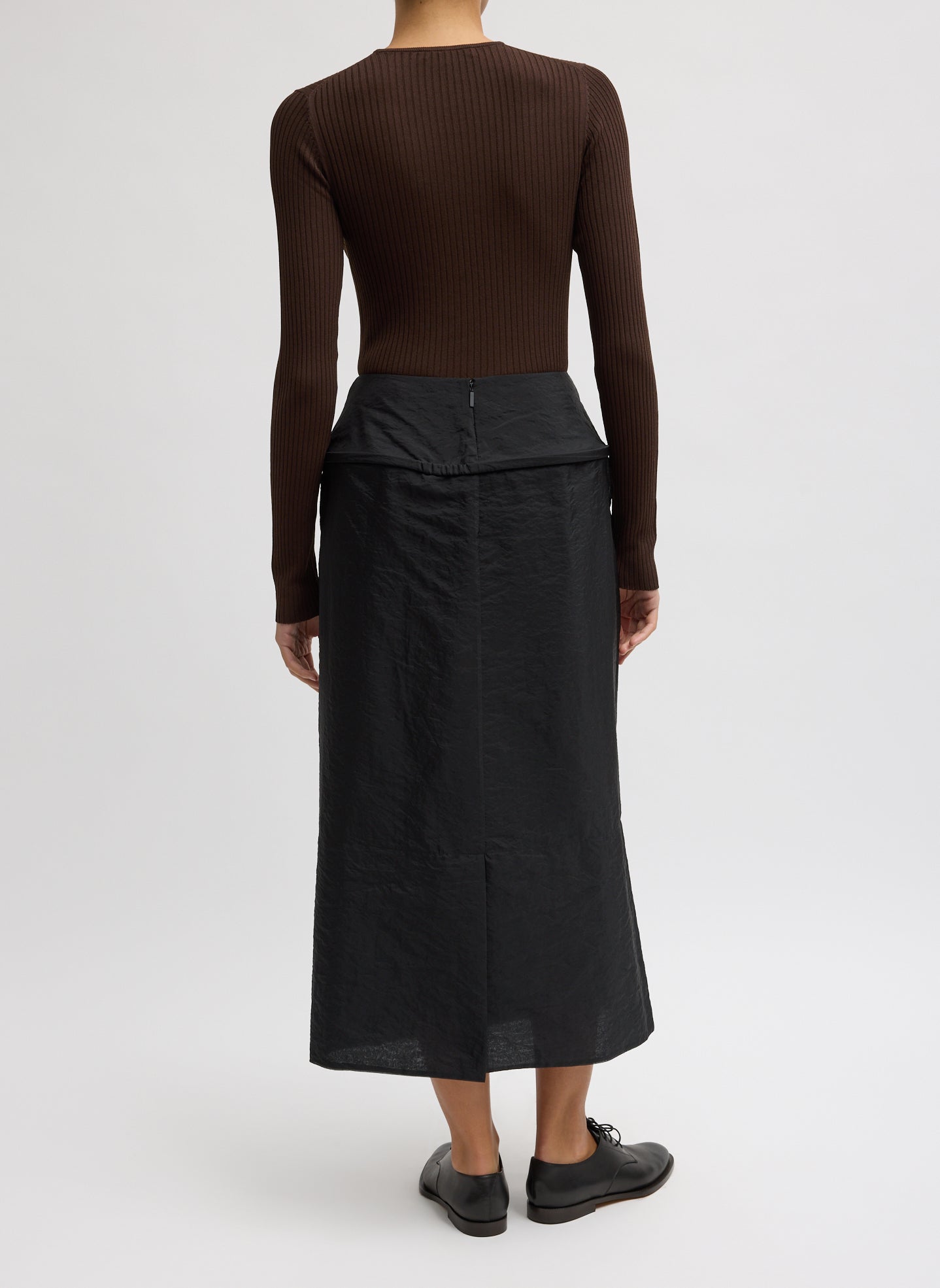 Black Chassis Hoop Pencil Skirt - midi skirt with hoop insert at waist, back view on model