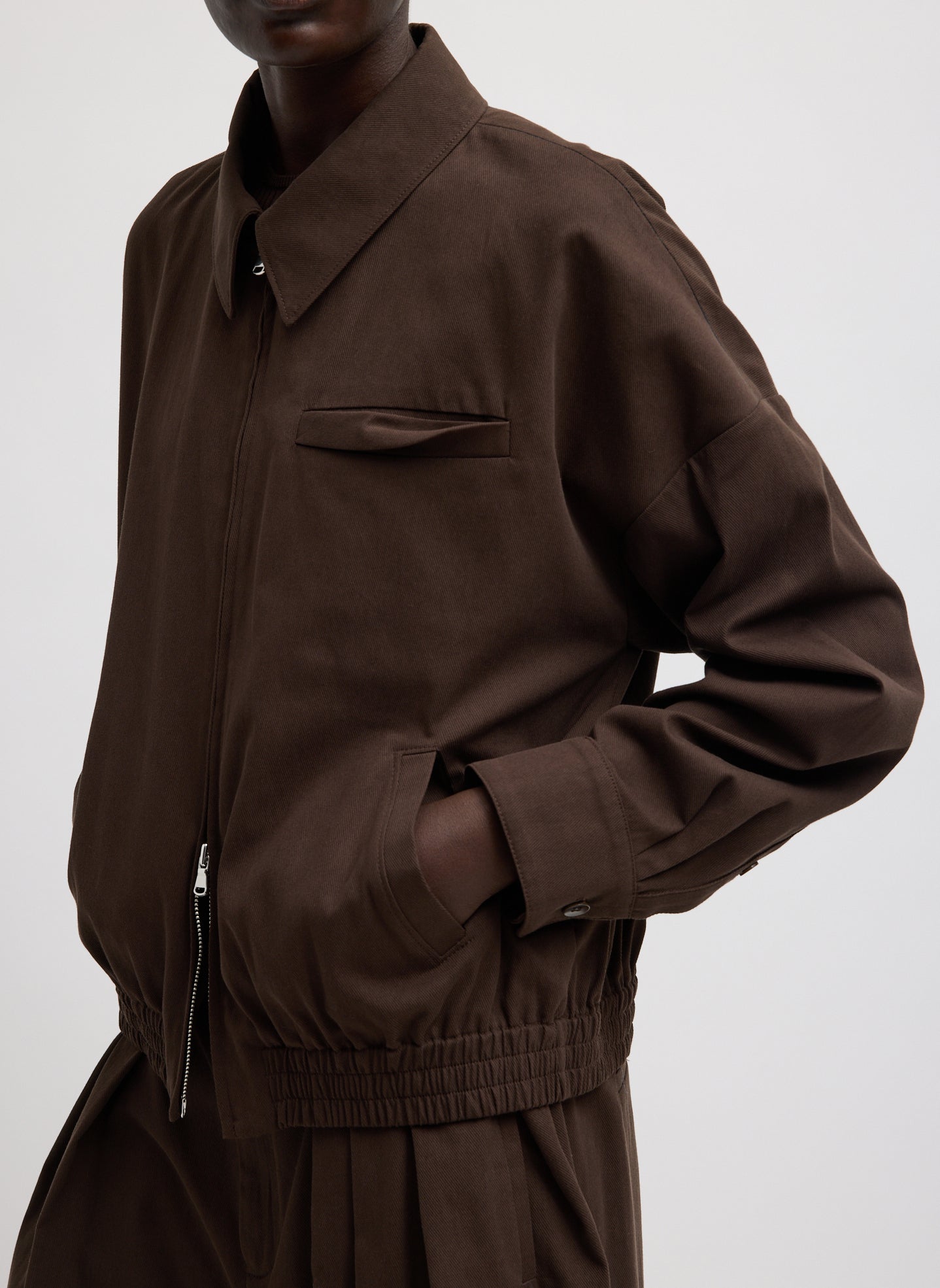 Hickory Brown Luxe Spring Twill Bomber Jacket - closeup of front pocket detail