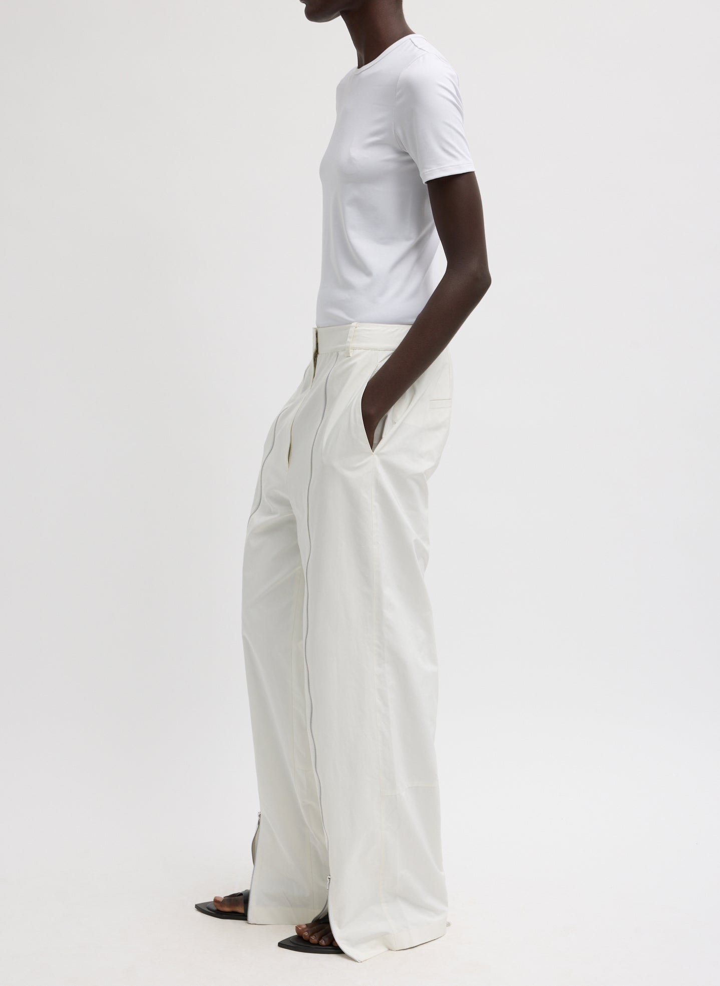 White Nylon Zipper Trouser - side view on model