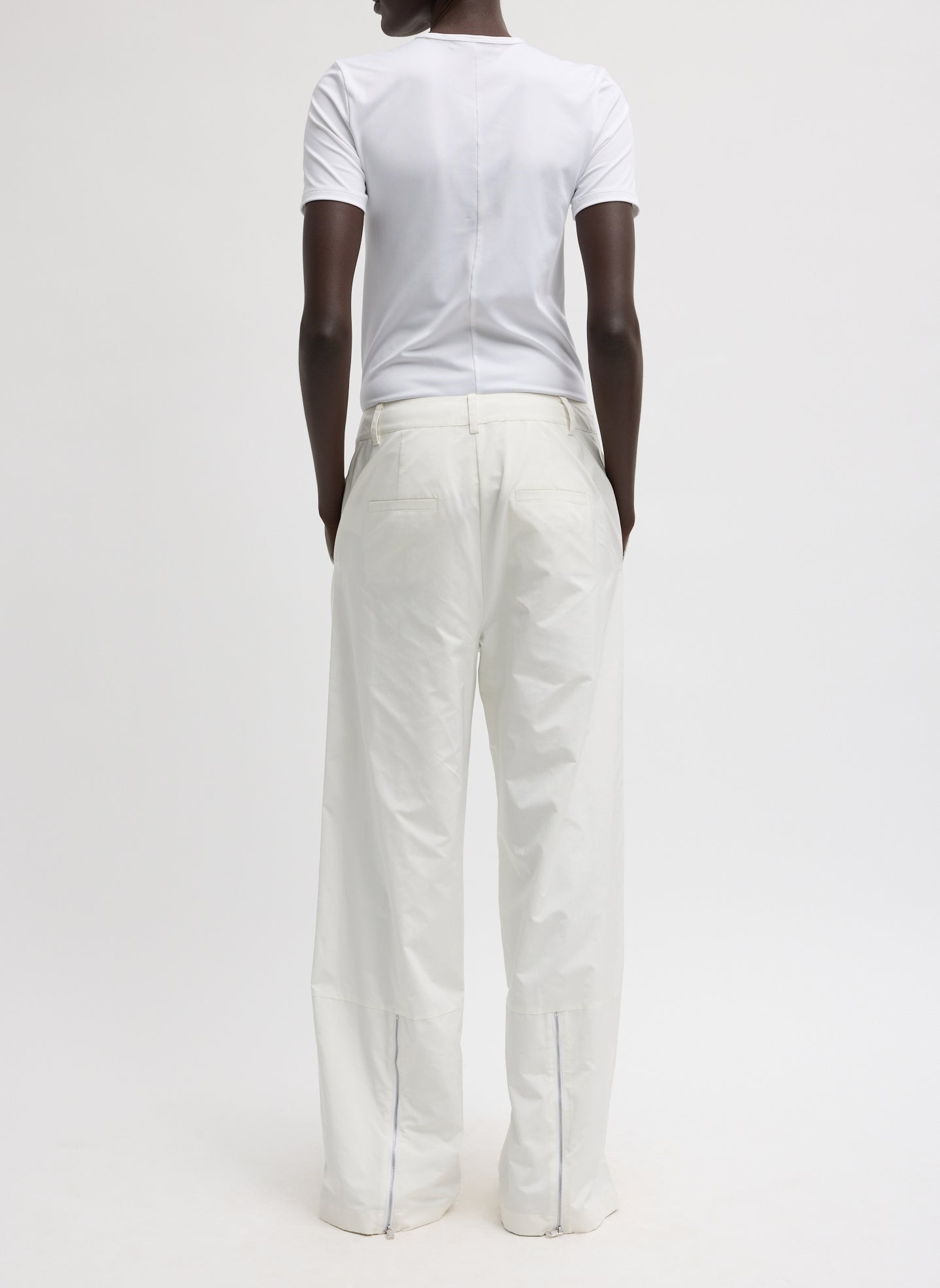 White Nylon Zipper Trouser - back view on model