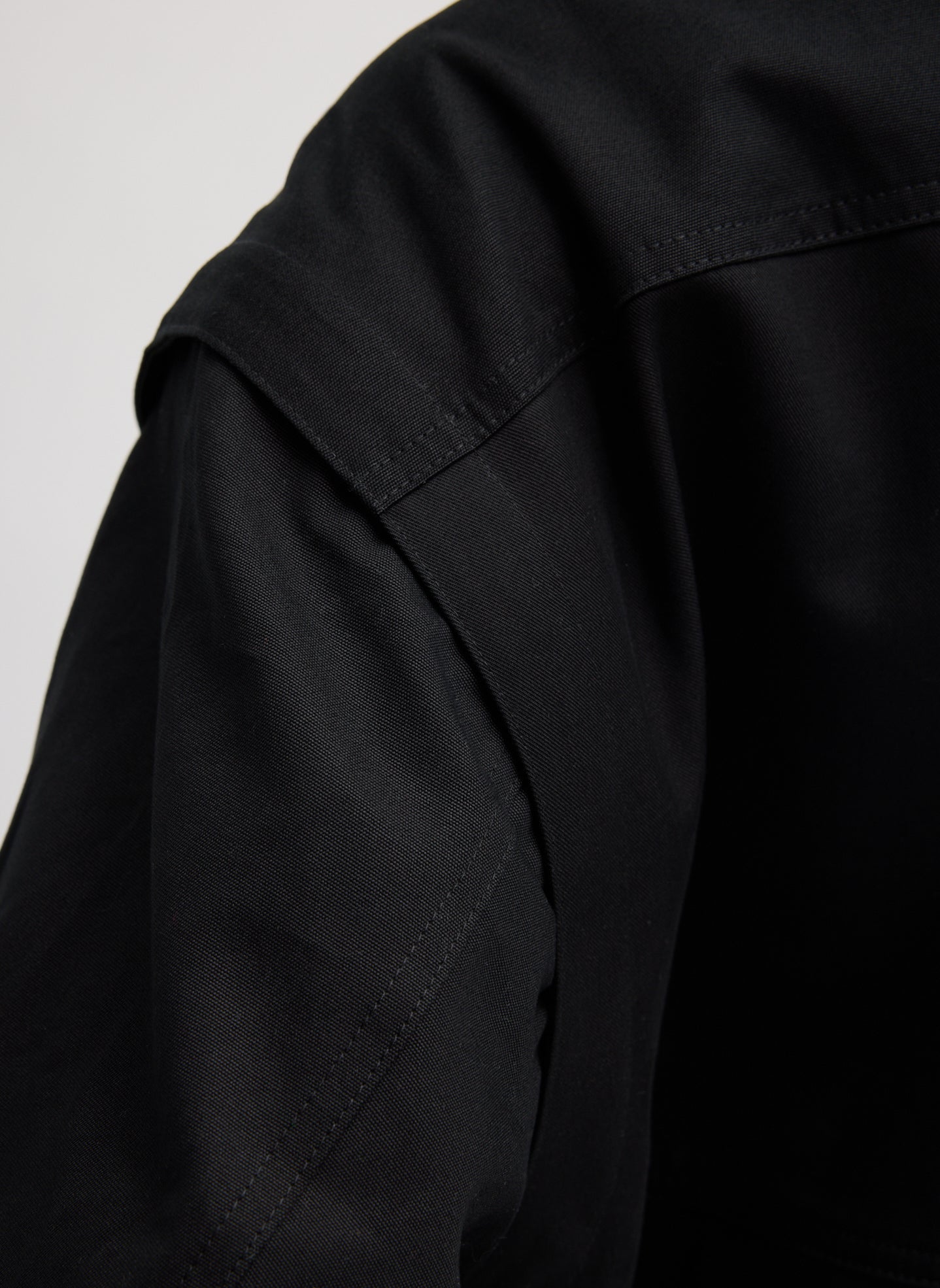 Black Patchwork Twill Bomber Jacket - closeup of shoulder detail