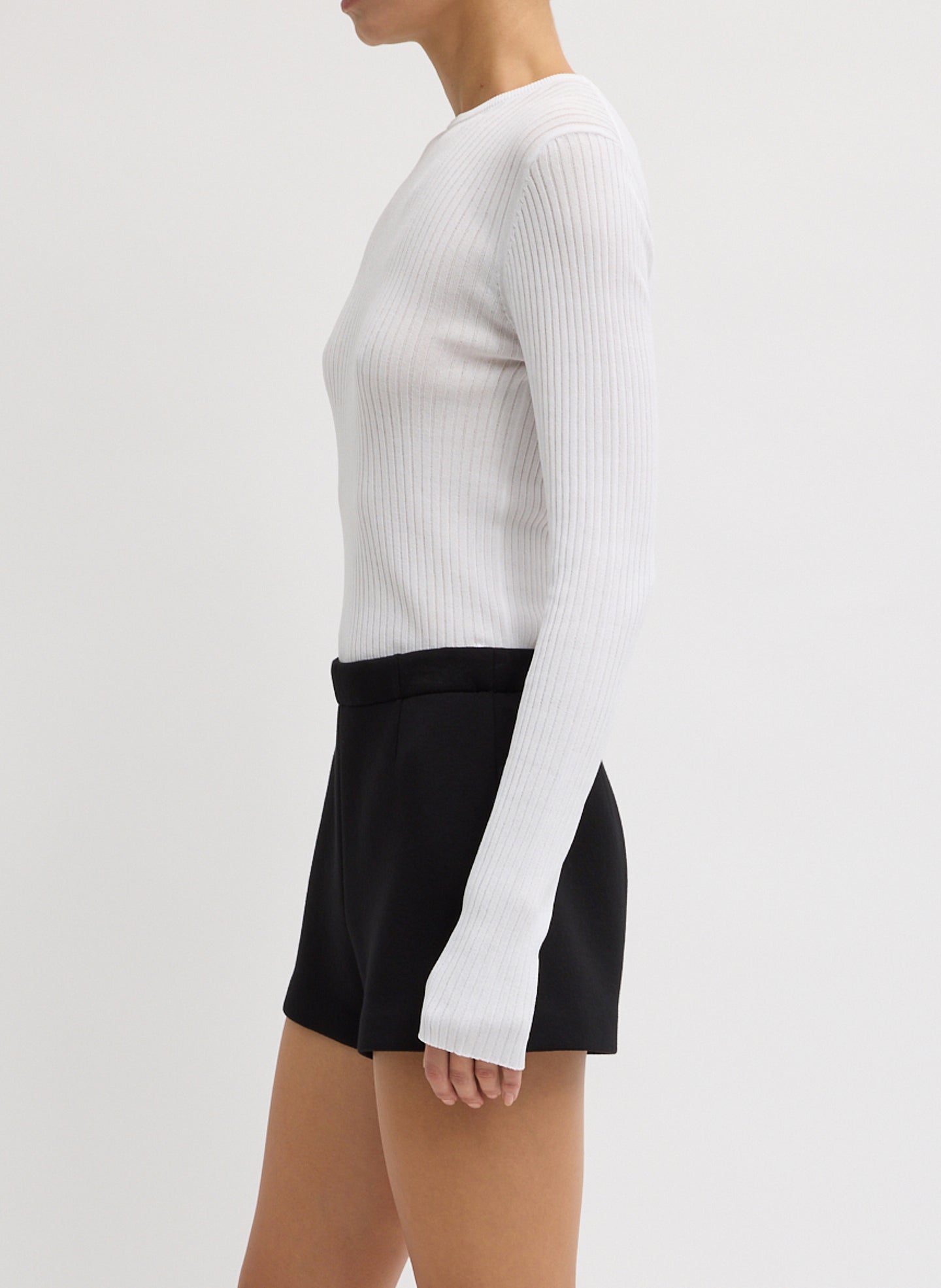 White Ribbed Crewneck - long sleeve, thin knit, side view on model