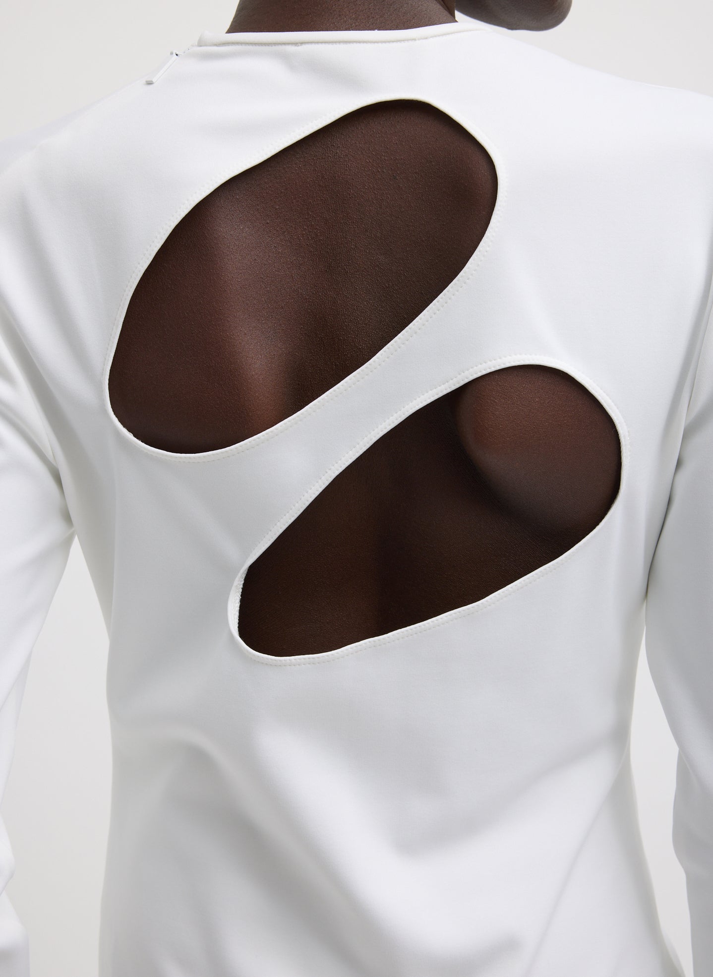 White Compact Ultra Stretch Cut Out Back Top - closeup of cutout details at back