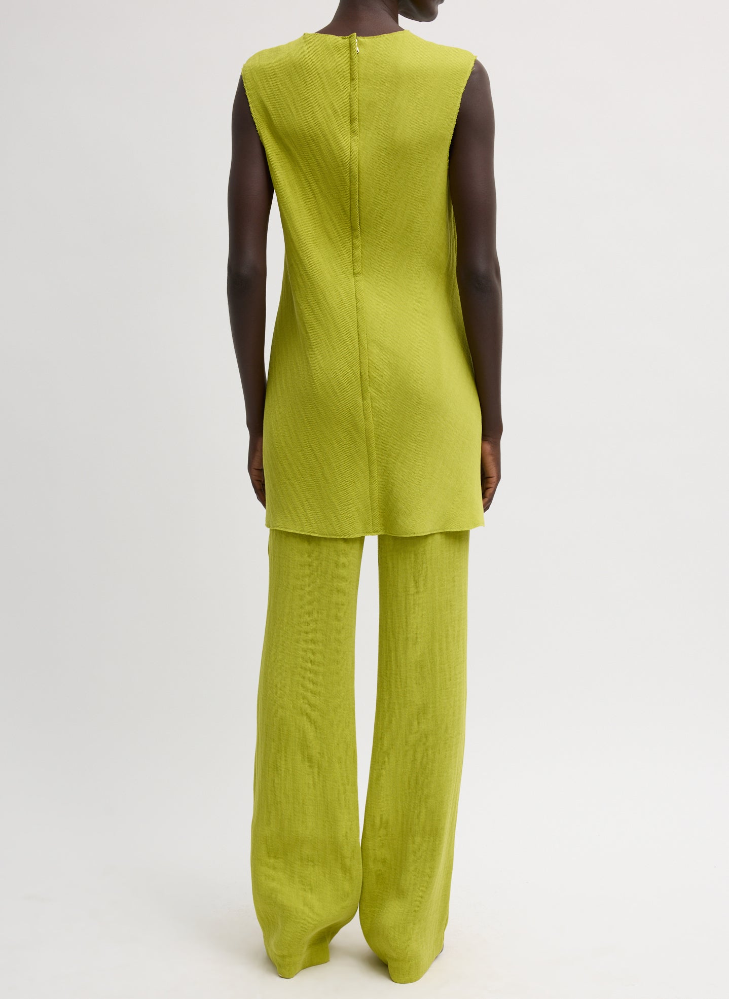 Chartreuse Viscose Plisse Sleeveless Bias Short Tunic - back view on model