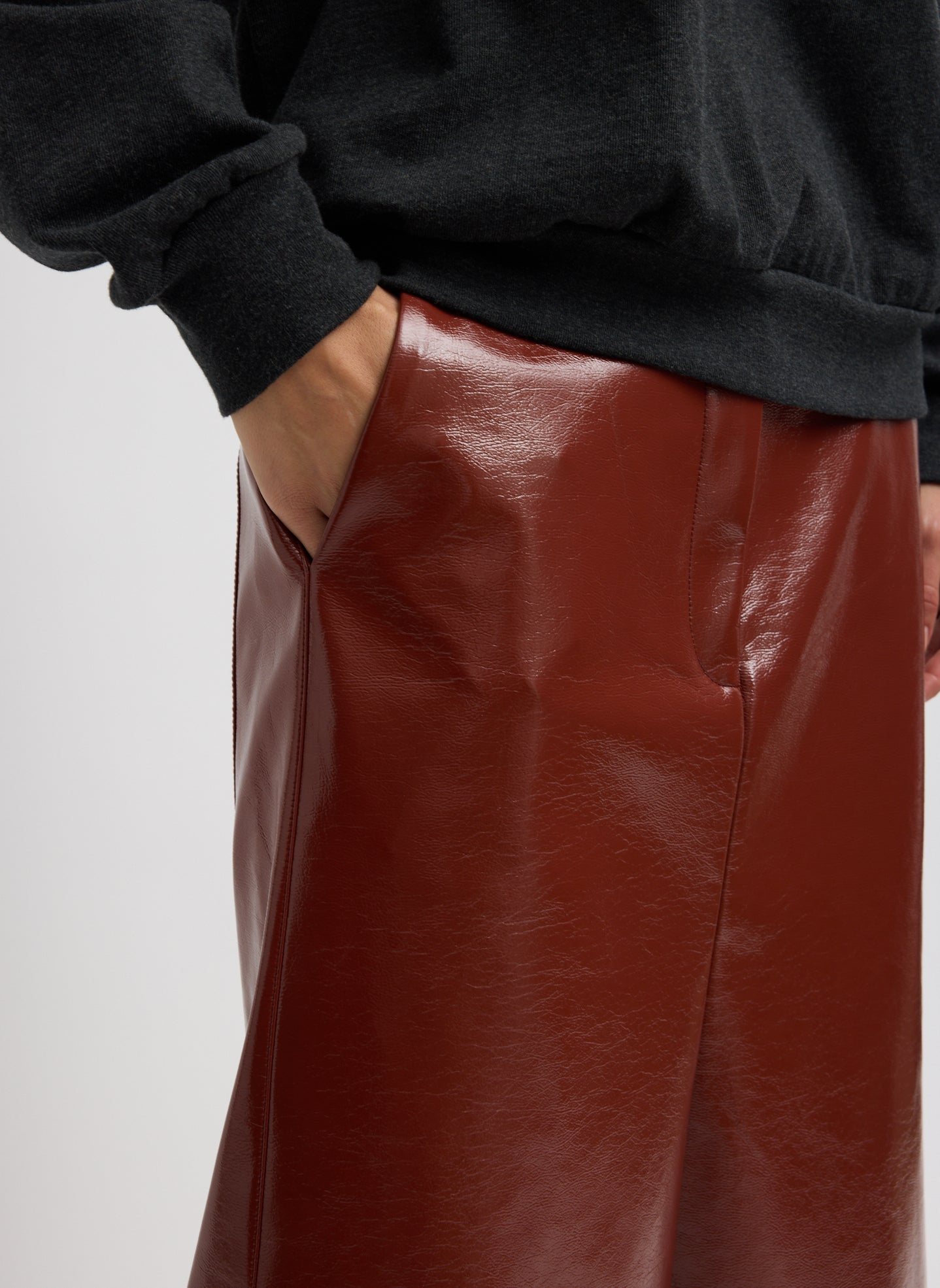 Warm Brown Faux Patent Leather Sculpted Silke Skirt - closeup of side pocket detail