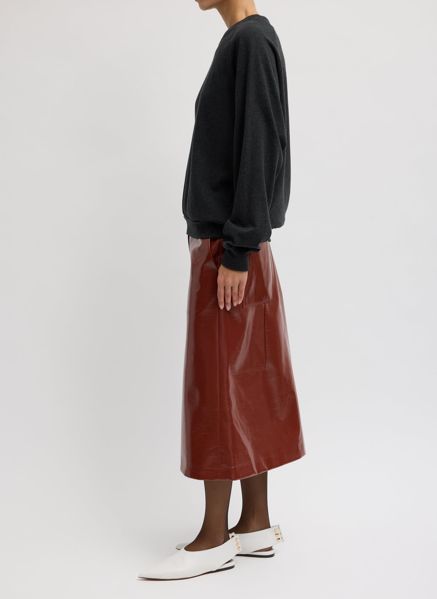 Warm Brown Faux Patent Leather Sculpted Silke Skirt - full look, side view on model