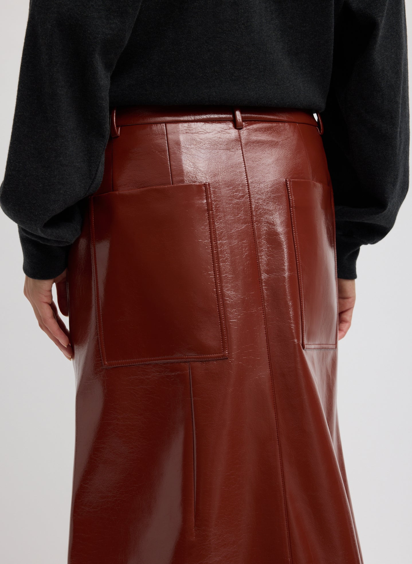 Warm Brown Faux Patent Leather Sculpted Silke Skirt - closeup of back pocket detail