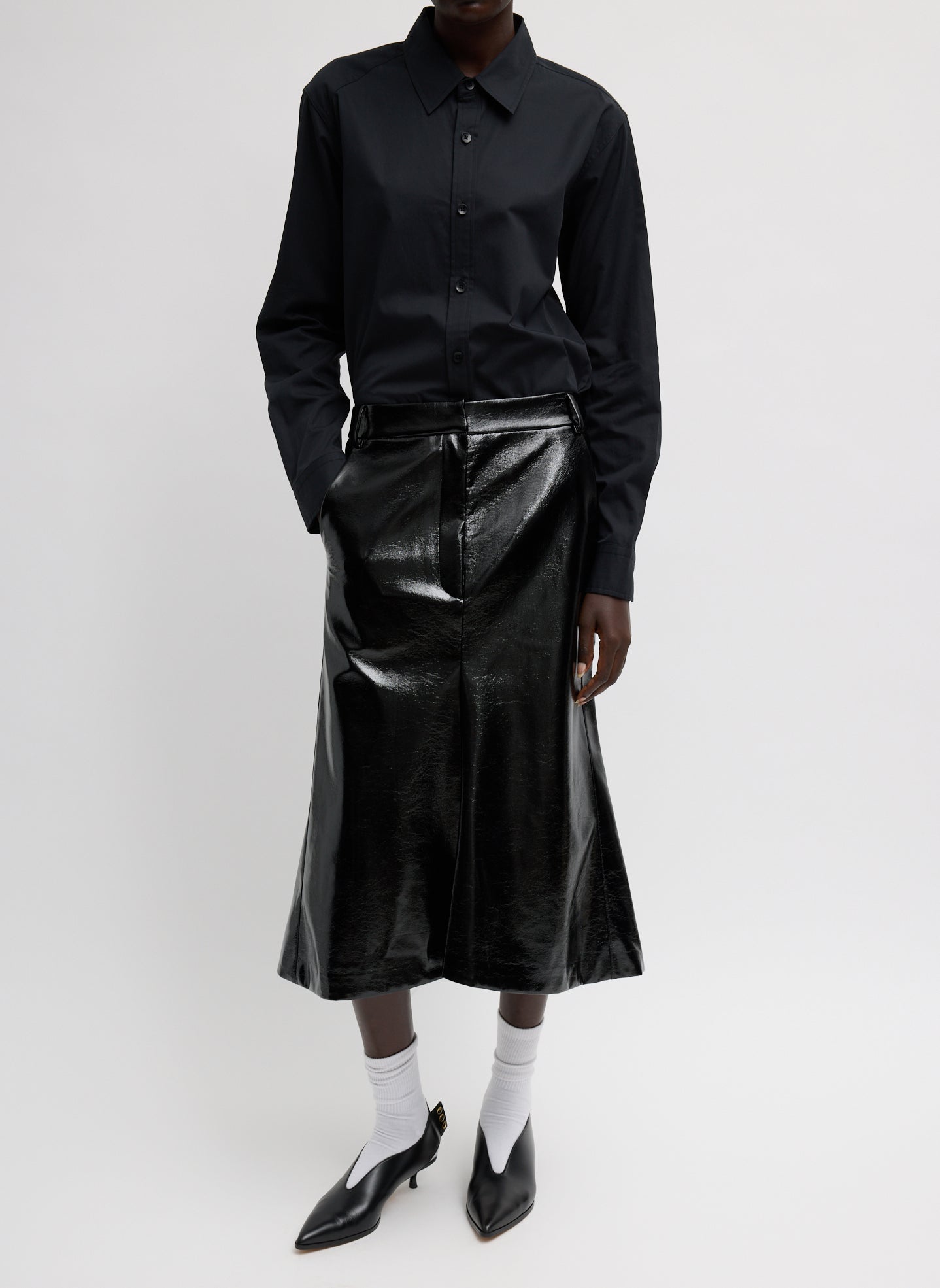 Faux Patent Leather Sculpted Silke Skirt - Black Faux Patent Leather Sculpted Silke Skirt - full look, front view on model