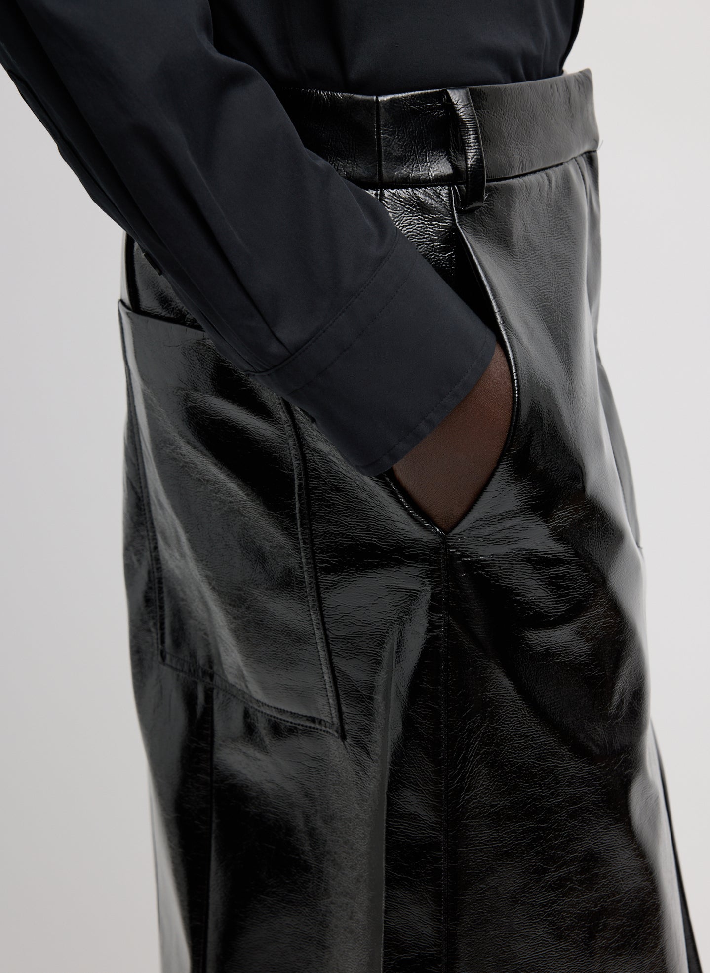Black Faux Patent Leather Sculpted Silke Skirt - closeup of side and back pocket details