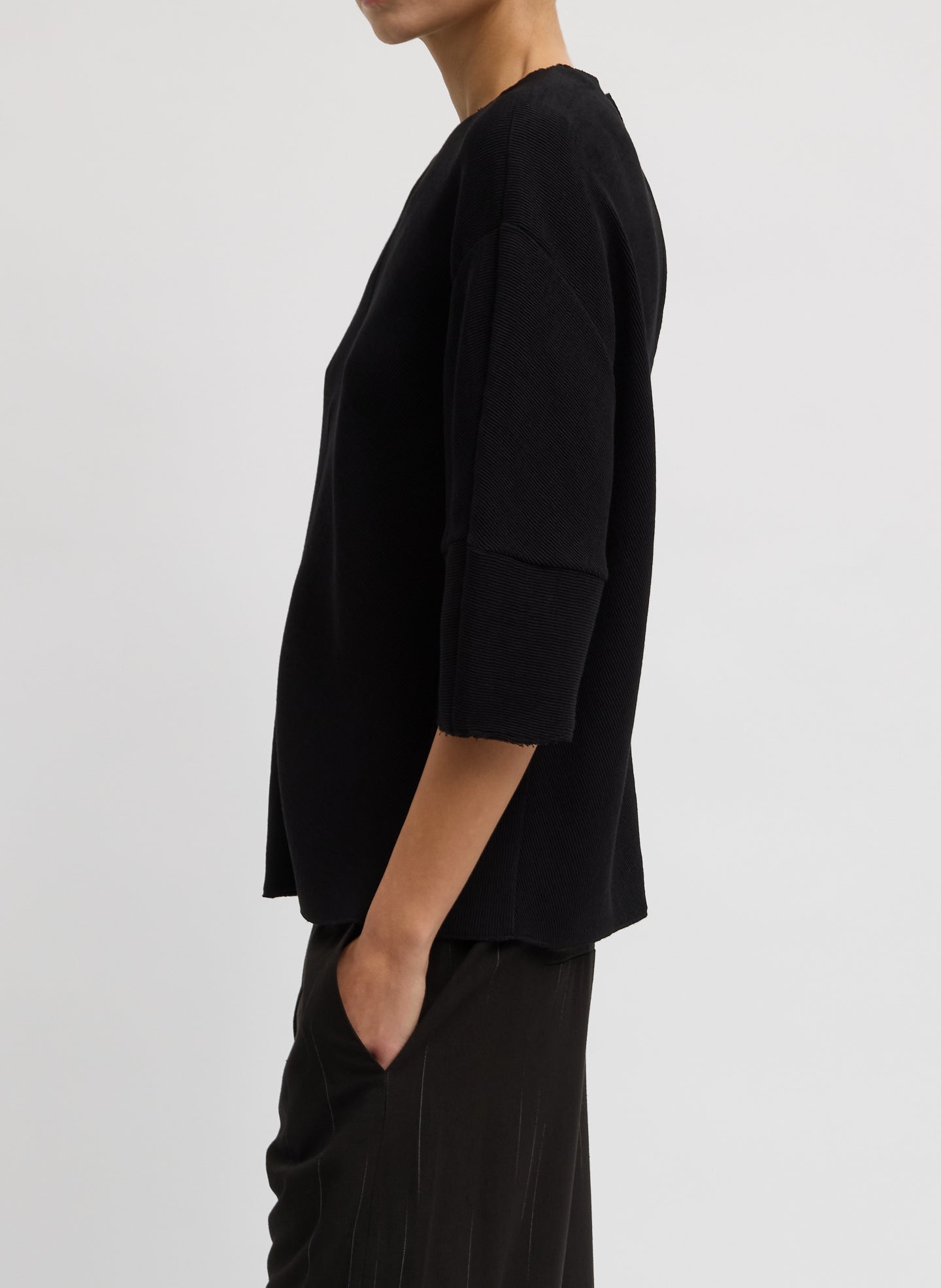 Black Viscose Plisse Hinged Short Sleeve Top - side view on model