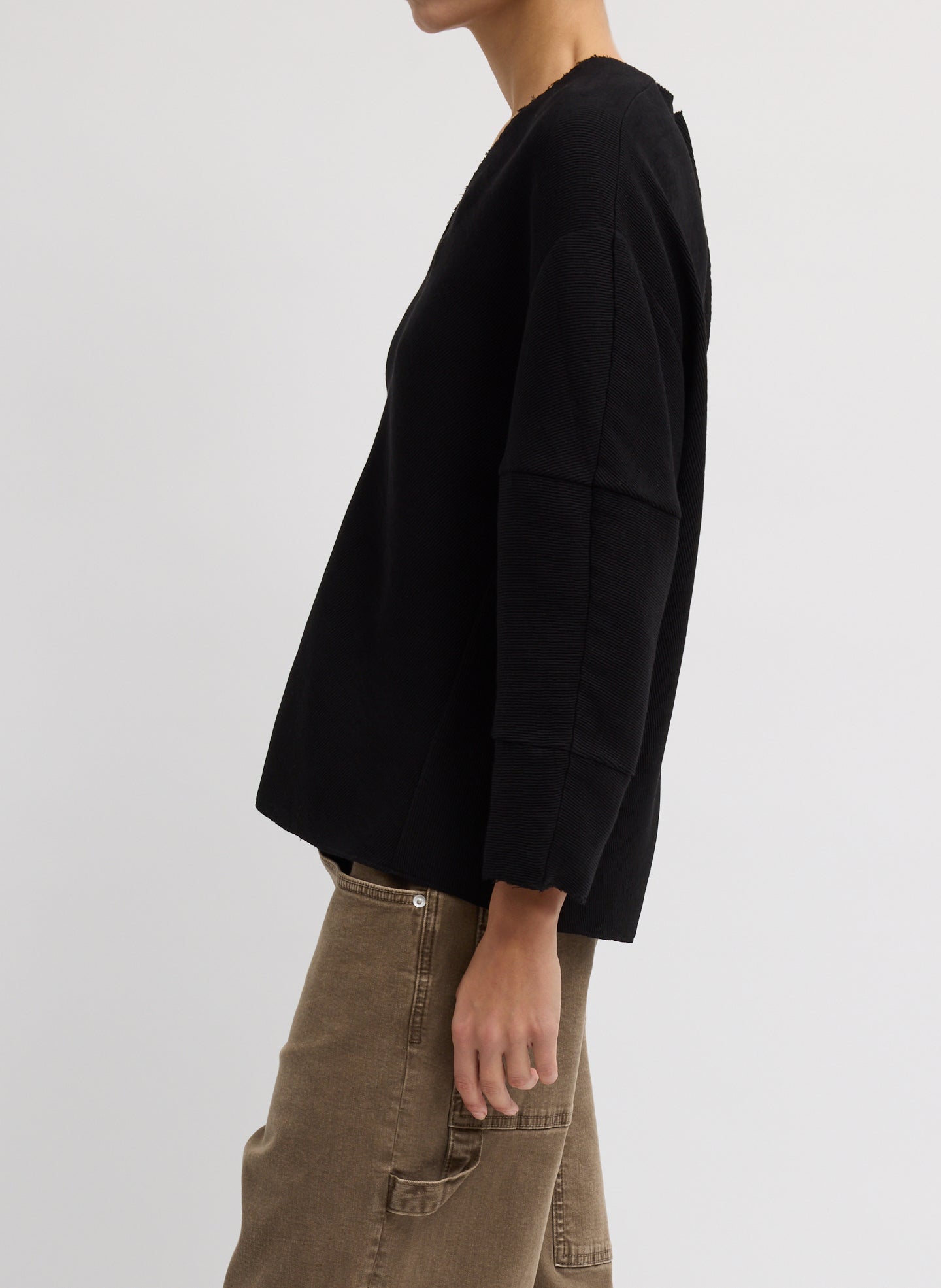 Black Viscose Plisse Hinged Long Sleeve Top - side view on model