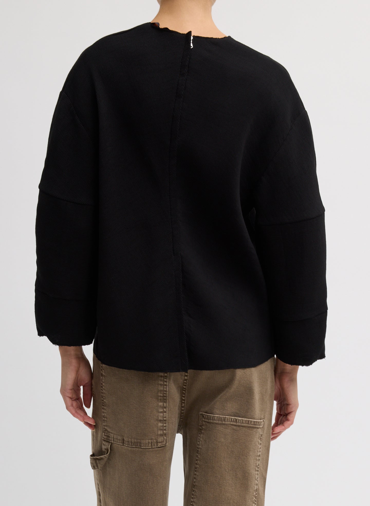 Black Viscose Plisse Hinged Long Sleeve Top - back view on model