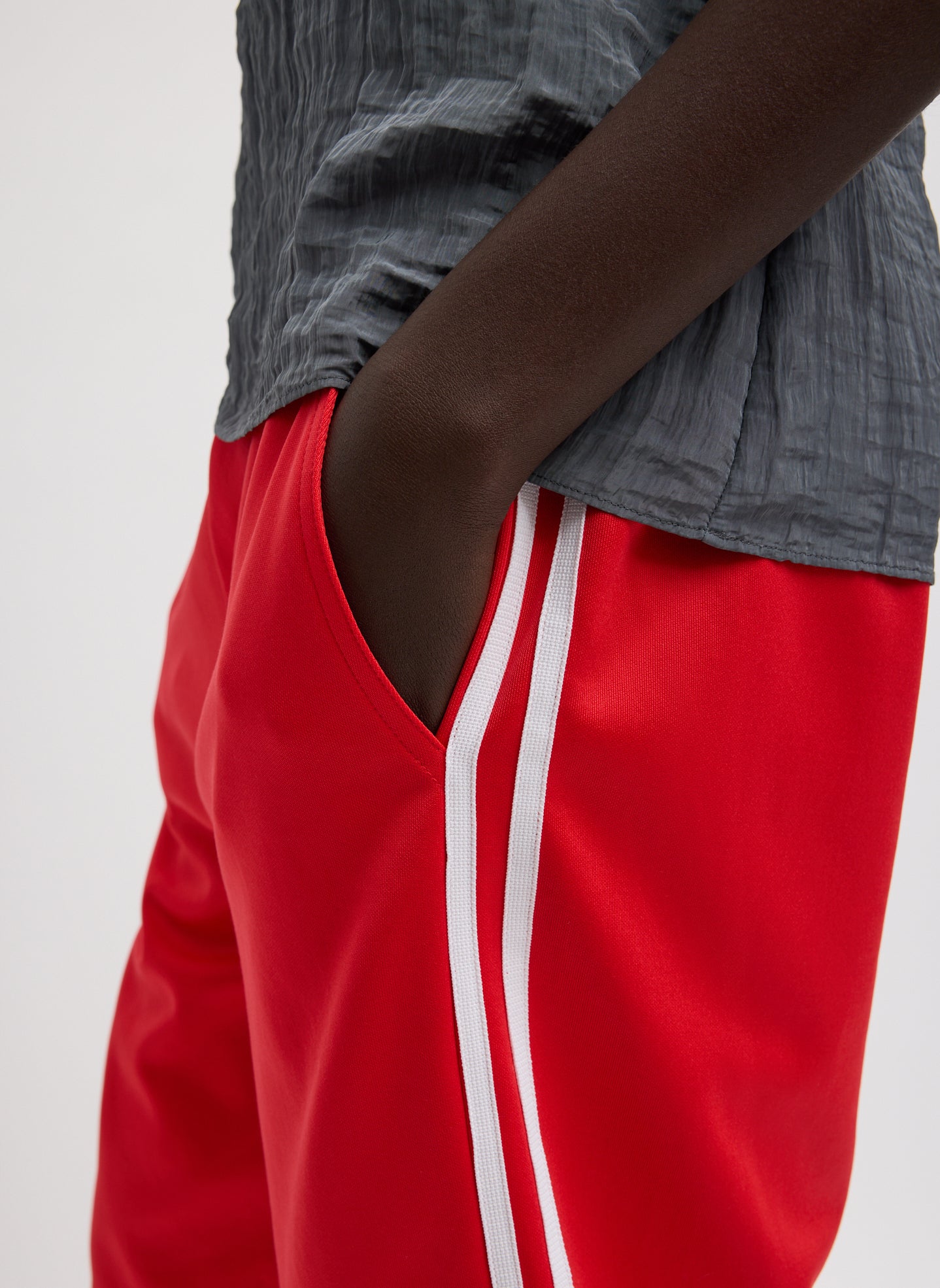Red Active Knit Short - closeup of side pocket and stripe detail
