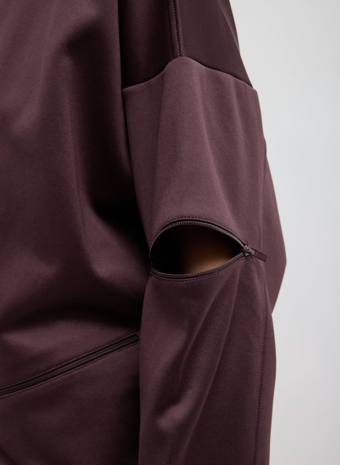 Brown Active Knit Zipper Detail Track Jacket - closeup of zip detail at sleeve