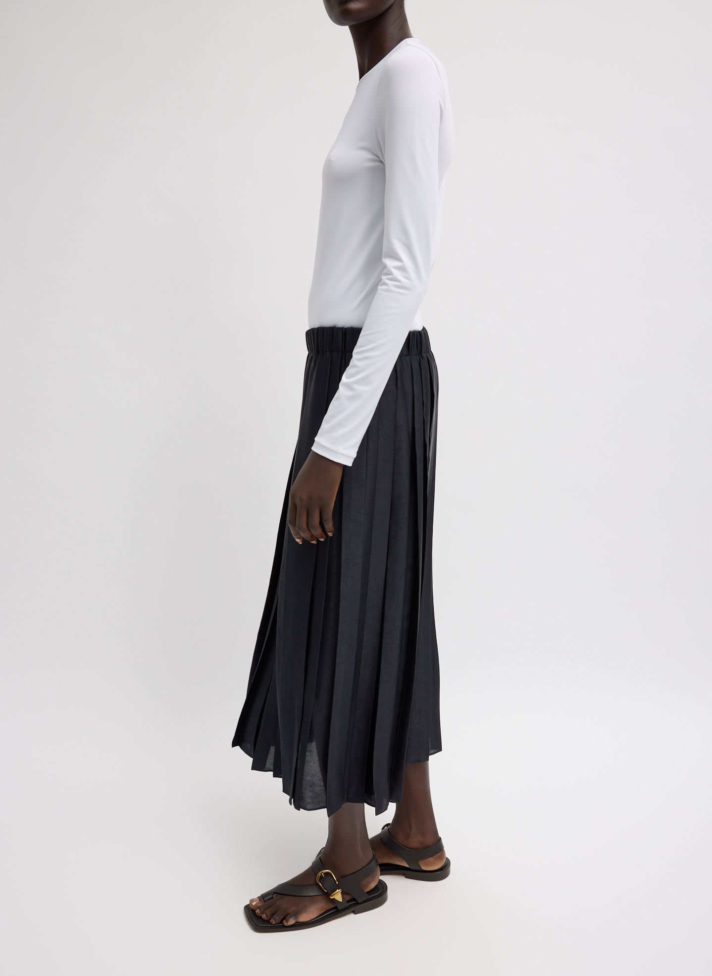 Black Feather Weight Pleated Pull On Skirt - pleated midi skirt, side view on model