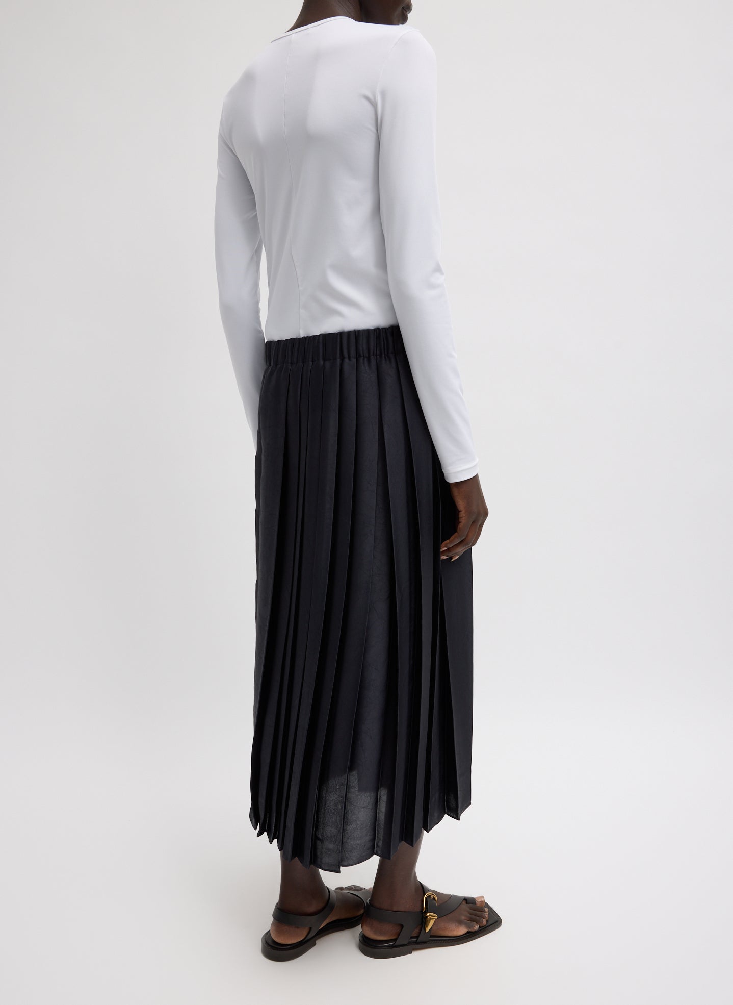 Black Feather Weight Pleated Pull On Skirt - pleated midi skirt, back view on model