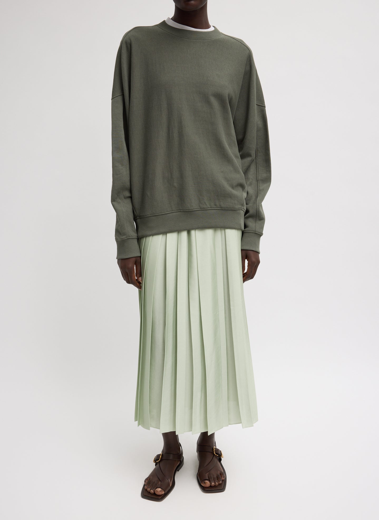 Feather Weight Pleated Pull On Skirt - Sage Green Feather Weight Pleated Pull on Skirt - pleated midi skirt, front view on model