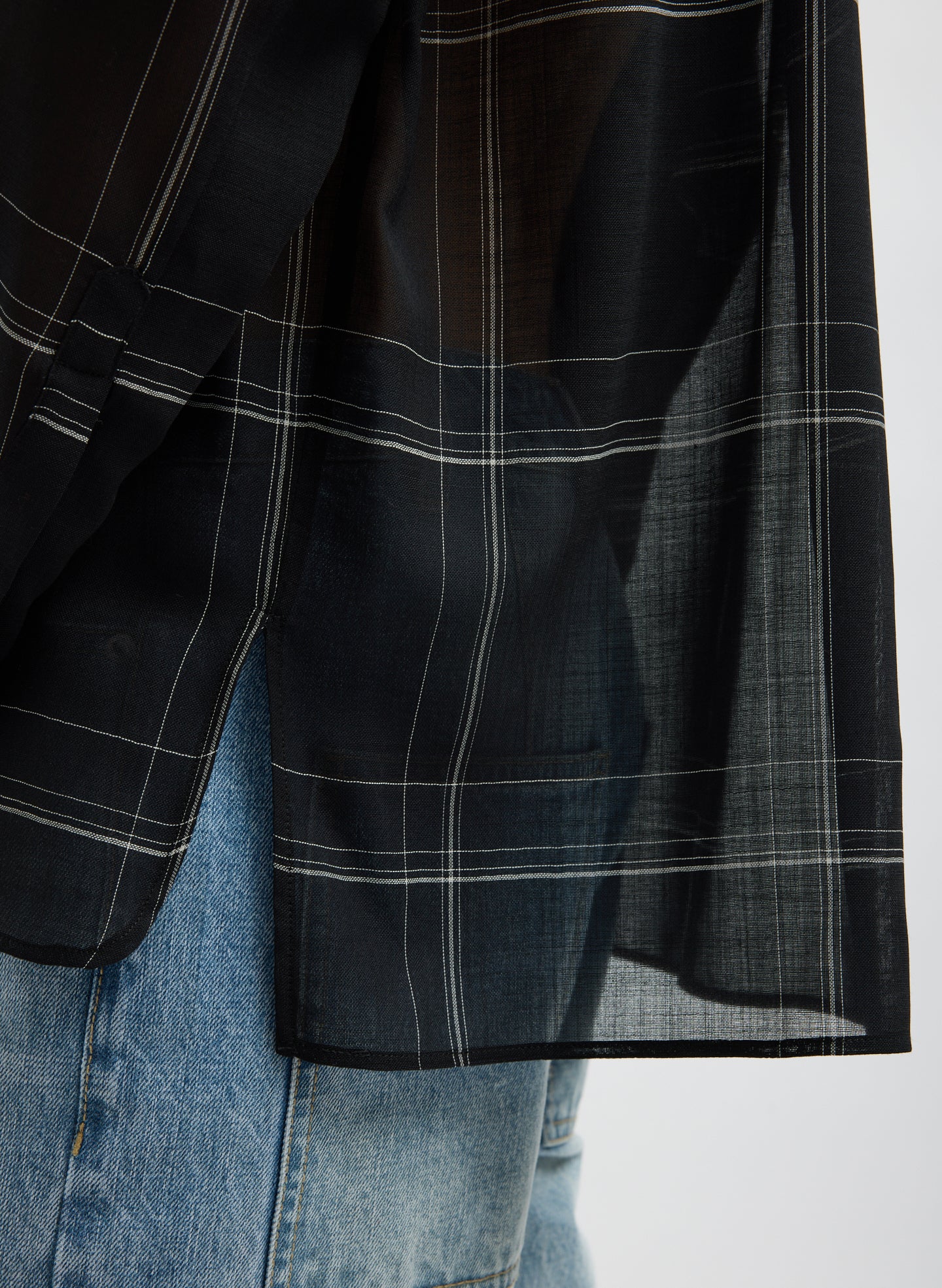 Black Sheer Wool Gauze Checked Oversized Shirt - closeup of hem detail