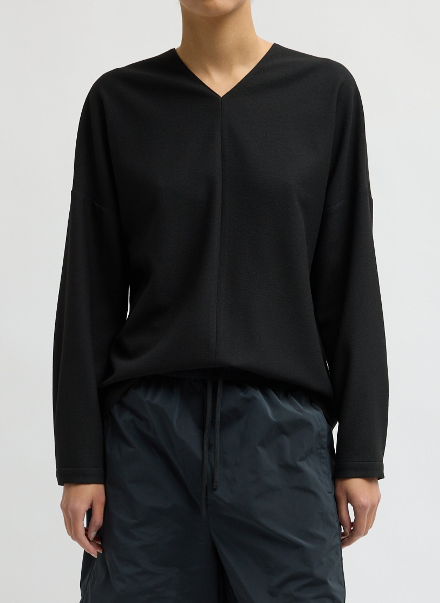 Black Mica Crepe V-Neck Top - long sleeve blouse, front view on model