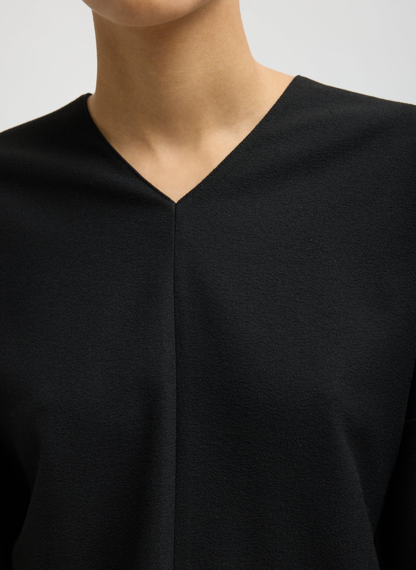 Black Mica Crepe V-Neck Top - closeup of neckline
