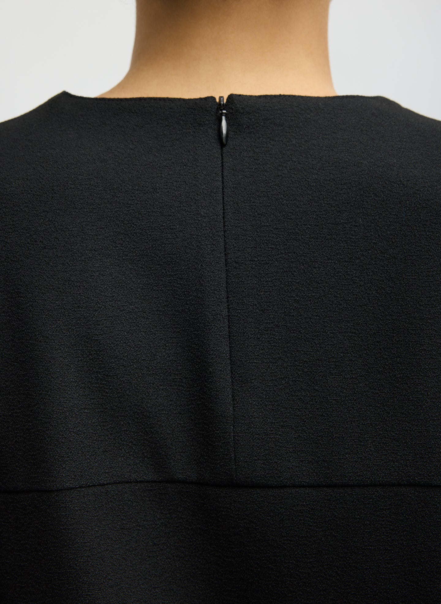 Black Mica Crepe V-Neck Top - closeup of zipper detail at back