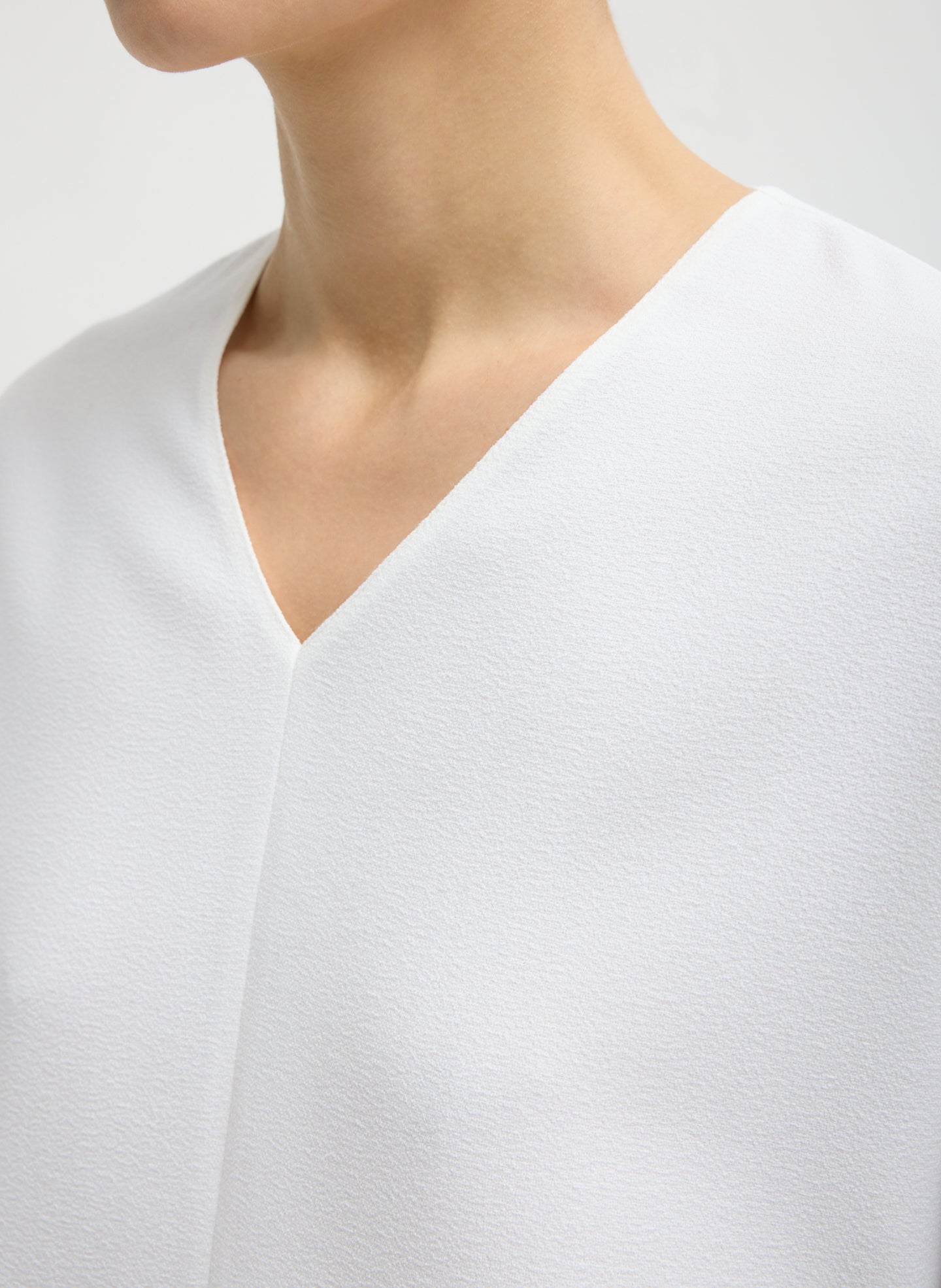 White Mica Crepe V-Neck Top - closeup of neckline