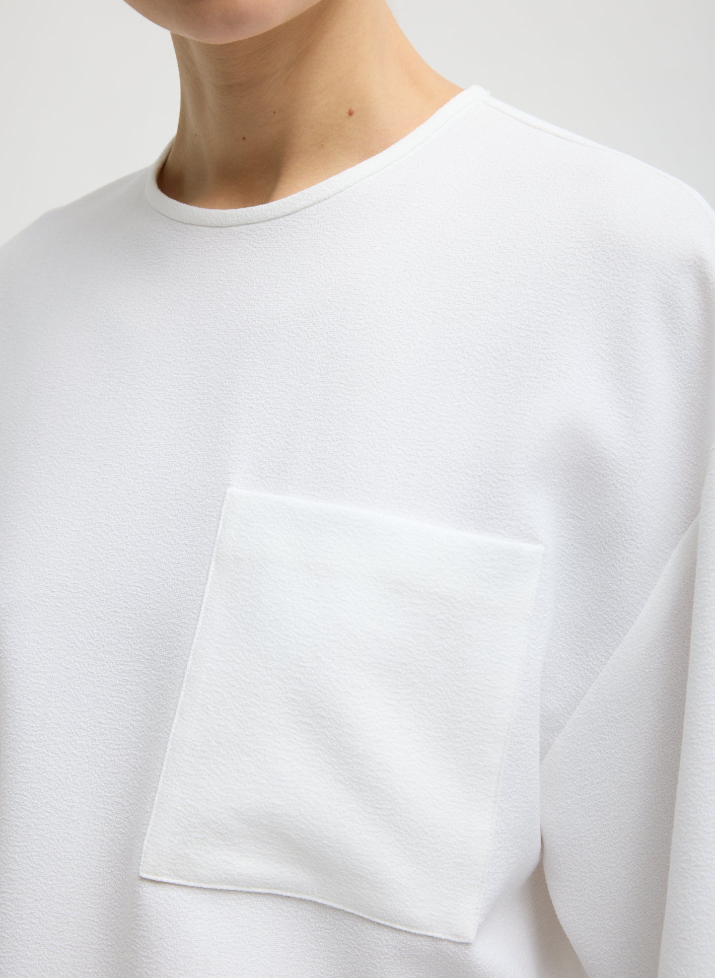 White Mica Crepe Easy T-Shirt - closeup of front pocket detail