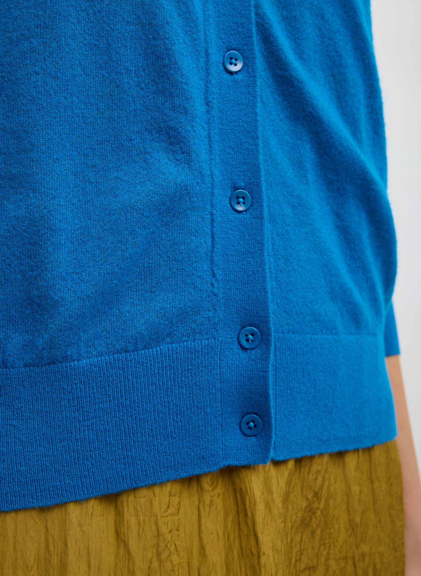 Bright Blue Skinlike Mercerized Wool V-Neck Shrunken Cardigan - closeup of button details at front