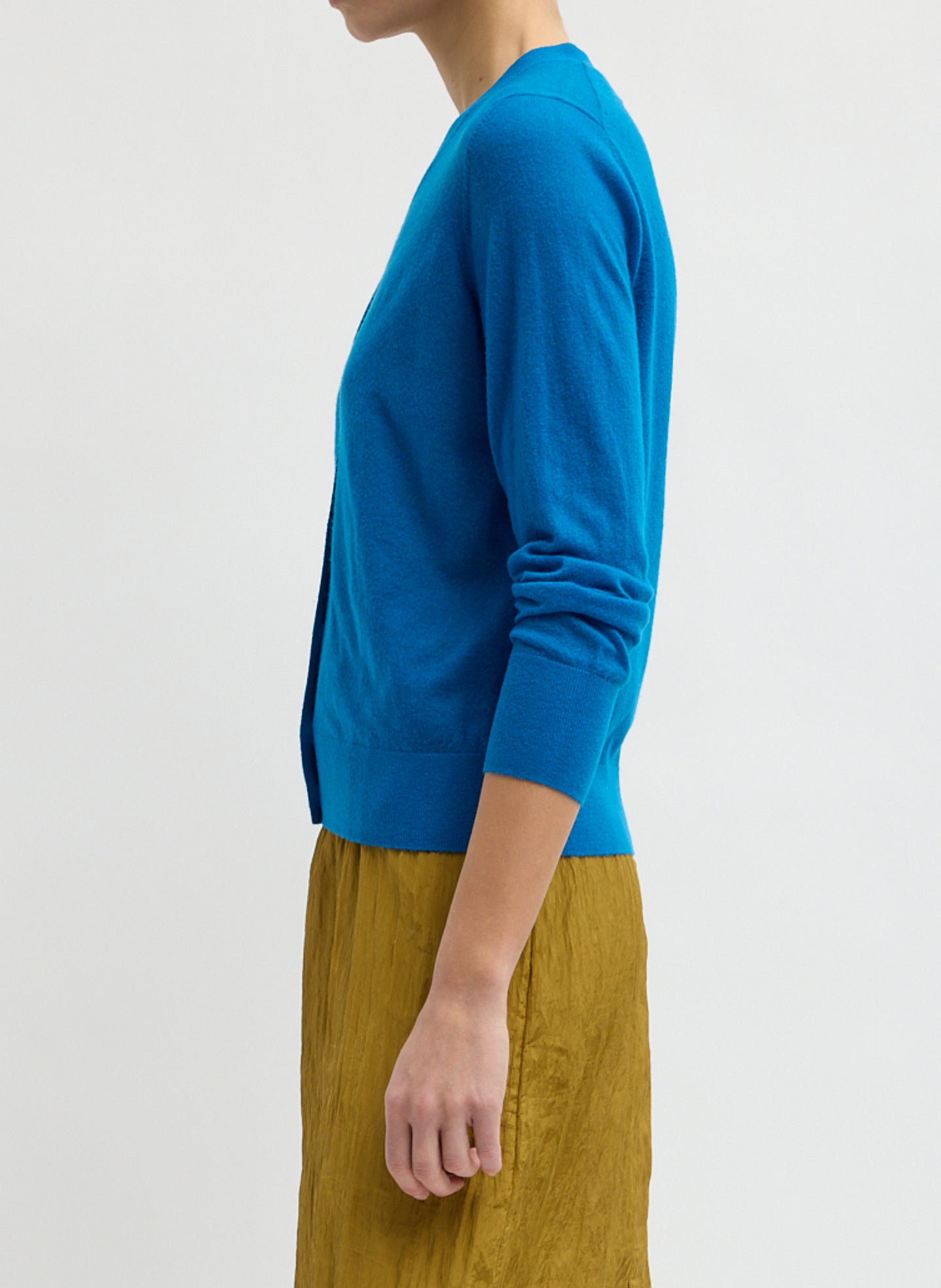 Bright Blue Skinlike Mercerized Wool V-Neck Shrunken Cardigan - side view on model
