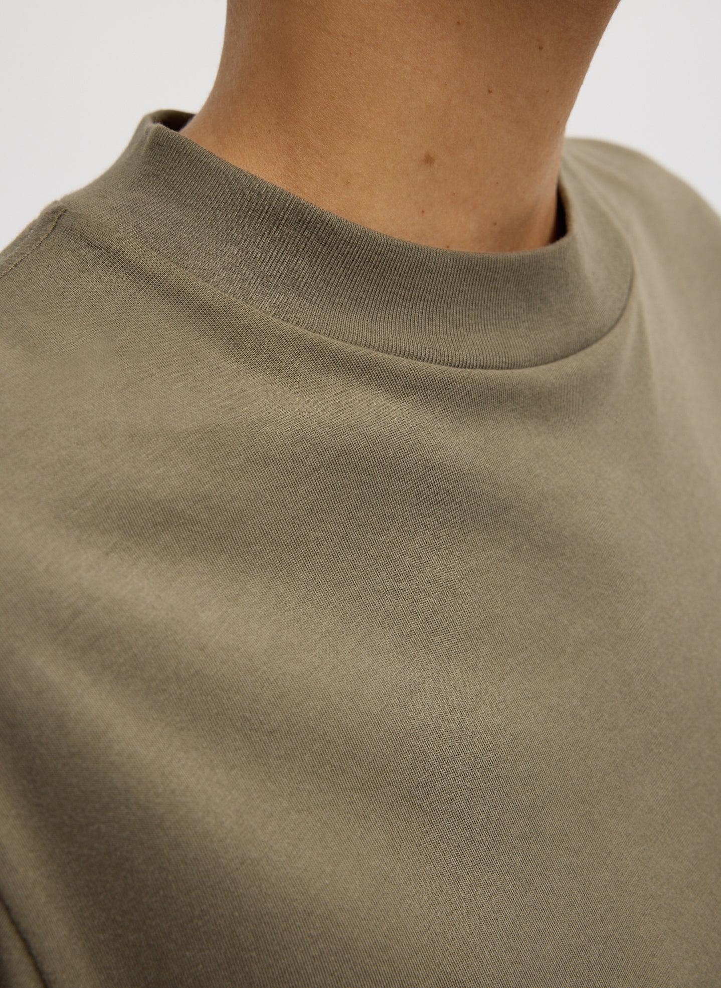Dune Olive Green Mock Neck Unisex T-Shirt - closeup of mock neckline