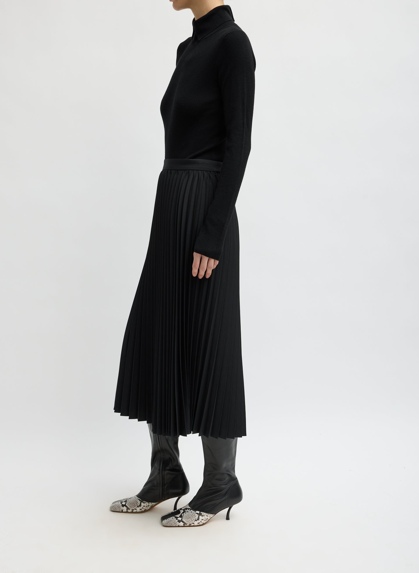 Black Tropical Wool Pleating Sunray Skirt - pleated midi skirt, side view on model