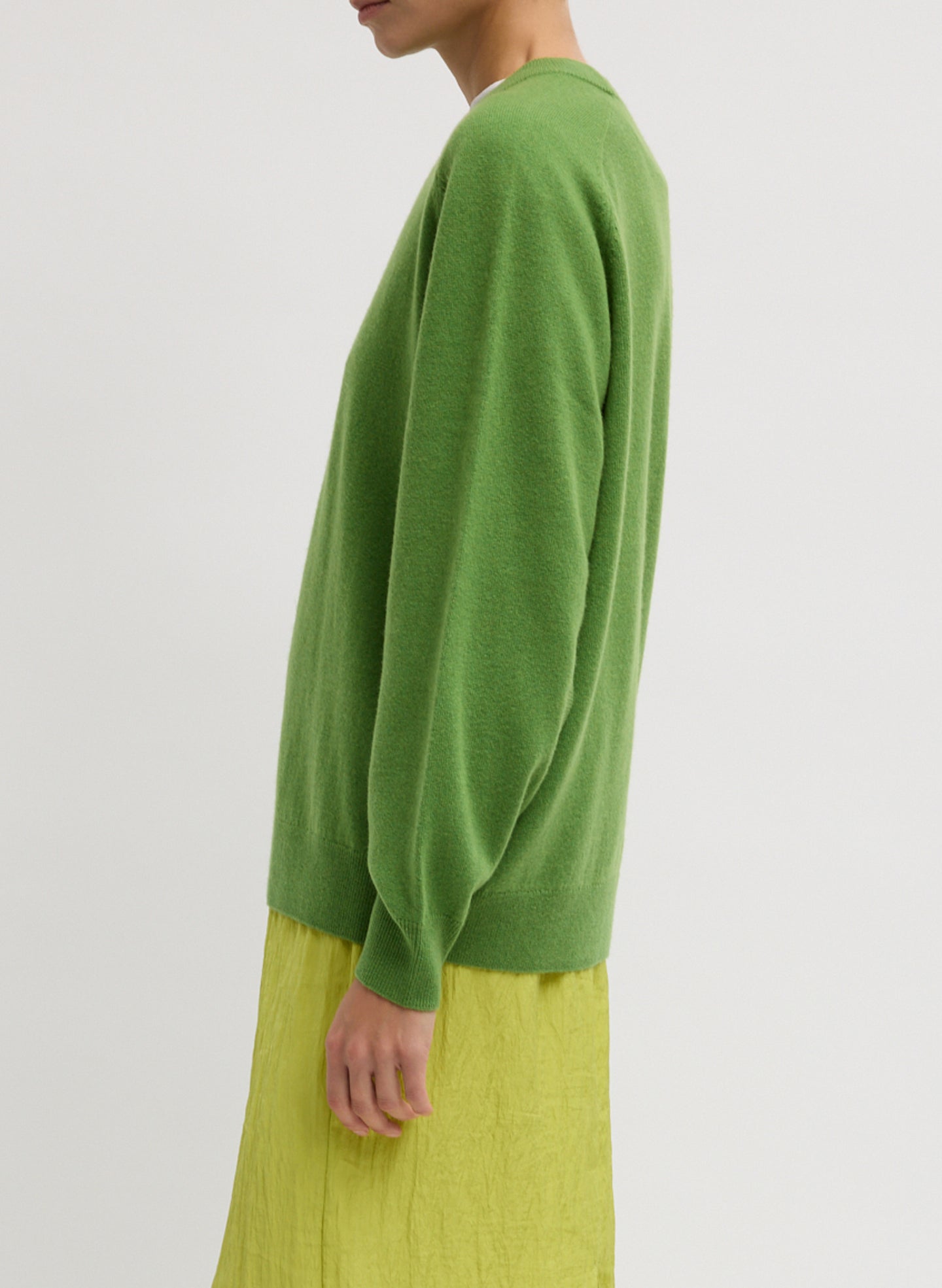 Avocado Green Washable Cashmere Crewneck Cutout Sleeve Sweater - relaxed fit, side view on model