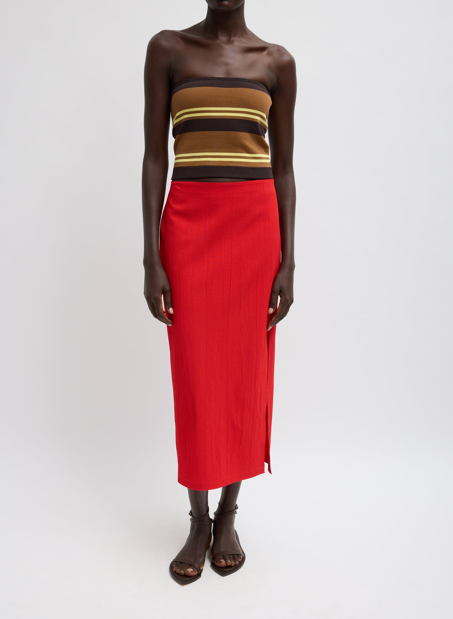 Creased Stretch Crepe Skirt - Red Creased Stretch Crepe Skirt - midi skirt with side slit, front view on model