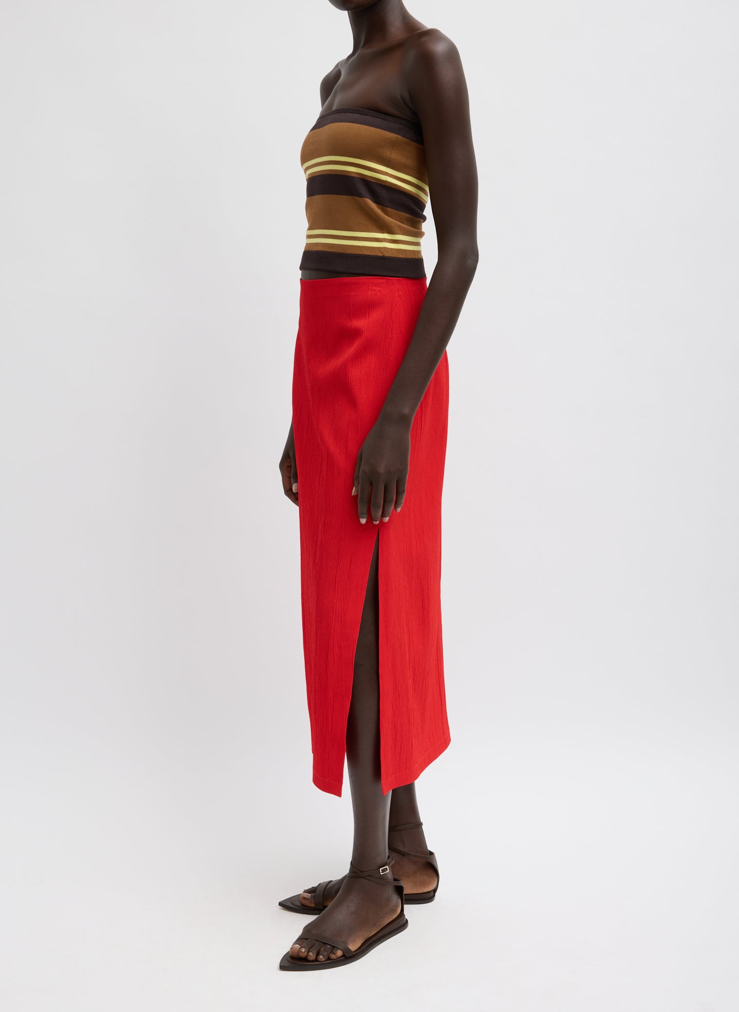 Red Creased Stretch Crepe Skirt - midi skirt with side slit, side view on model