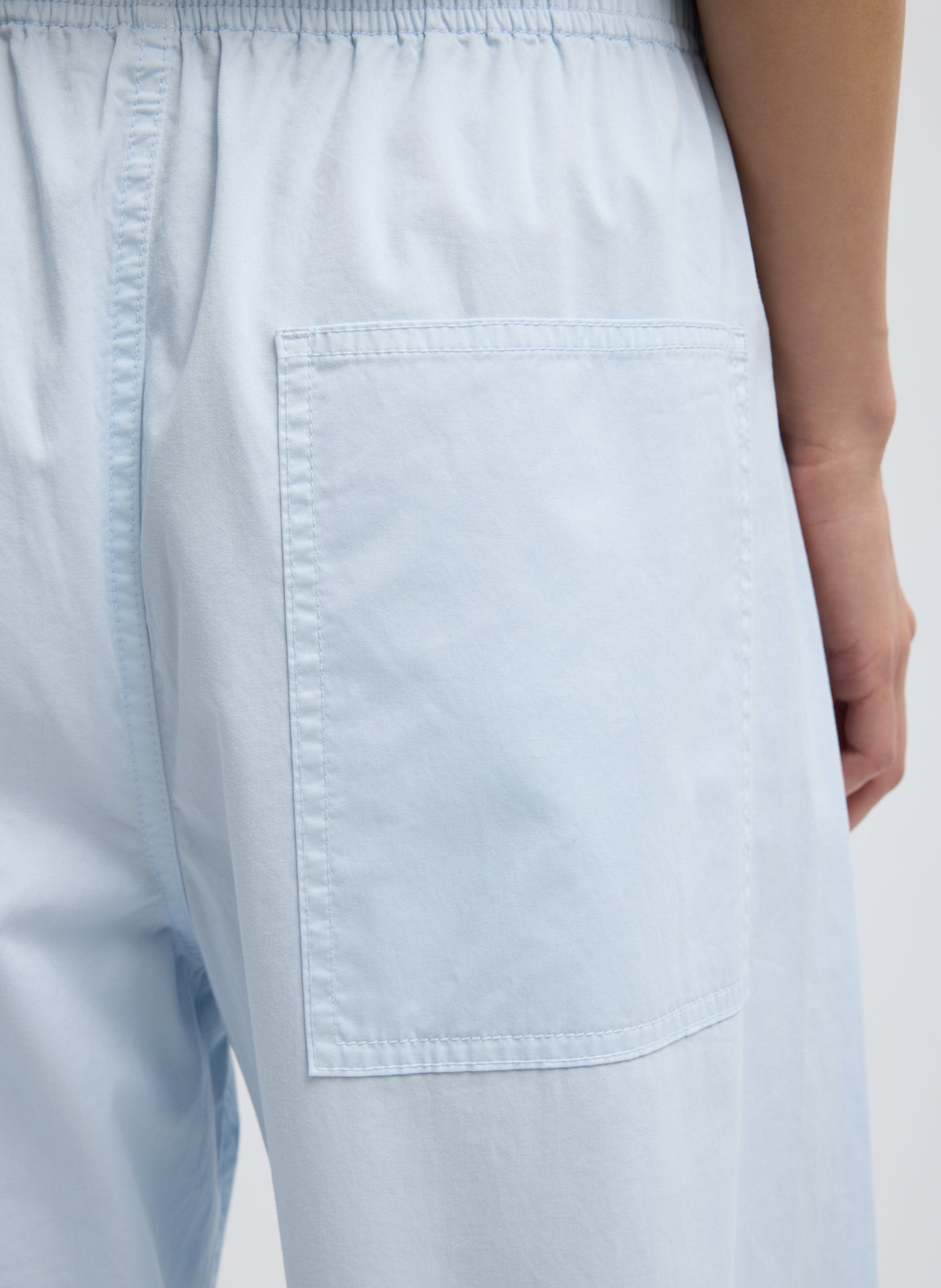 Pale Blue Garment Dyed Silky Cotton Winslow Pull On Pant - closeup of back pocket detail