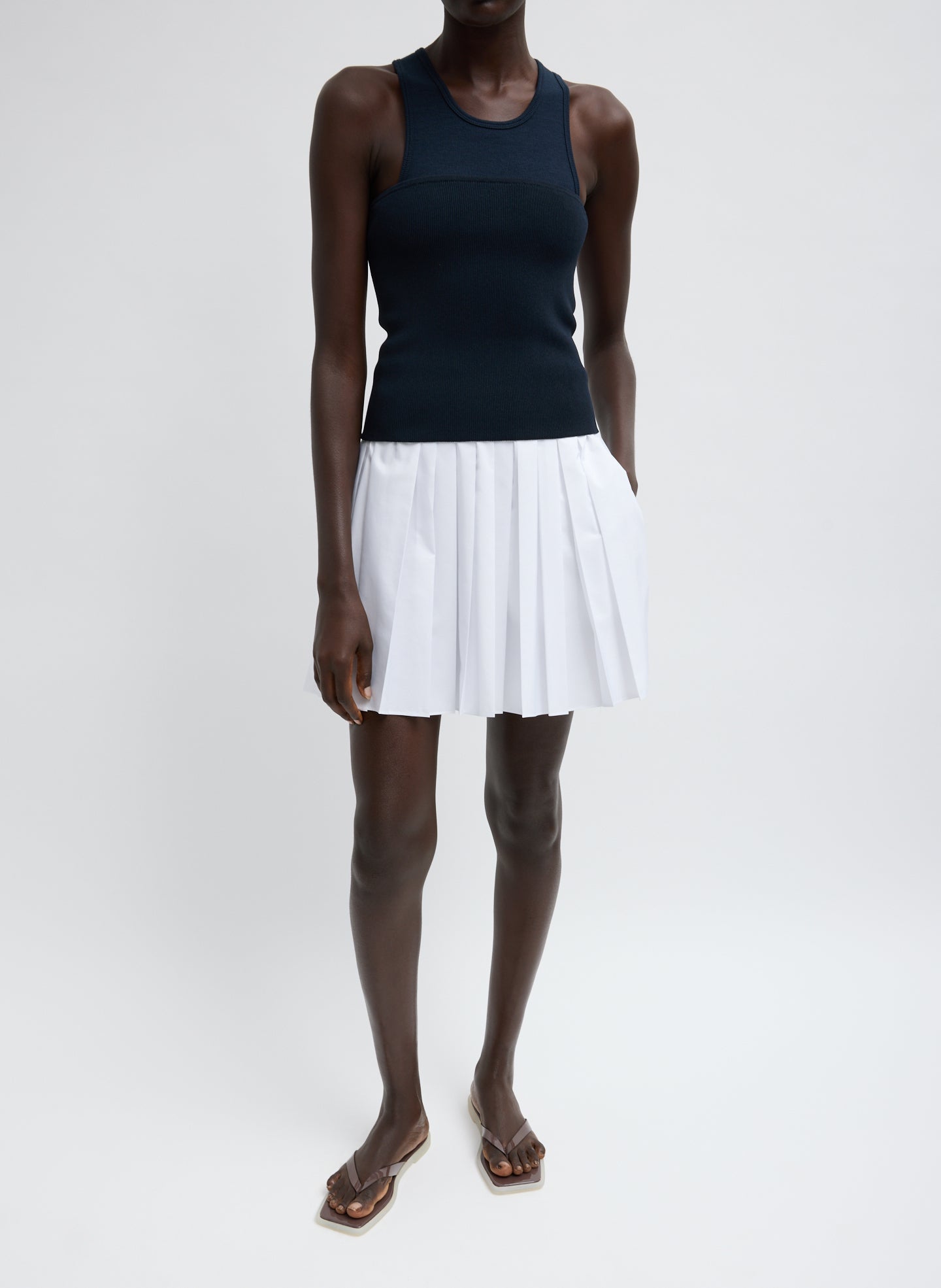 Summer Nylon Pull On Mini Skirt - White Summer Nylon Pleated Mini Skirt - full look, front view on model