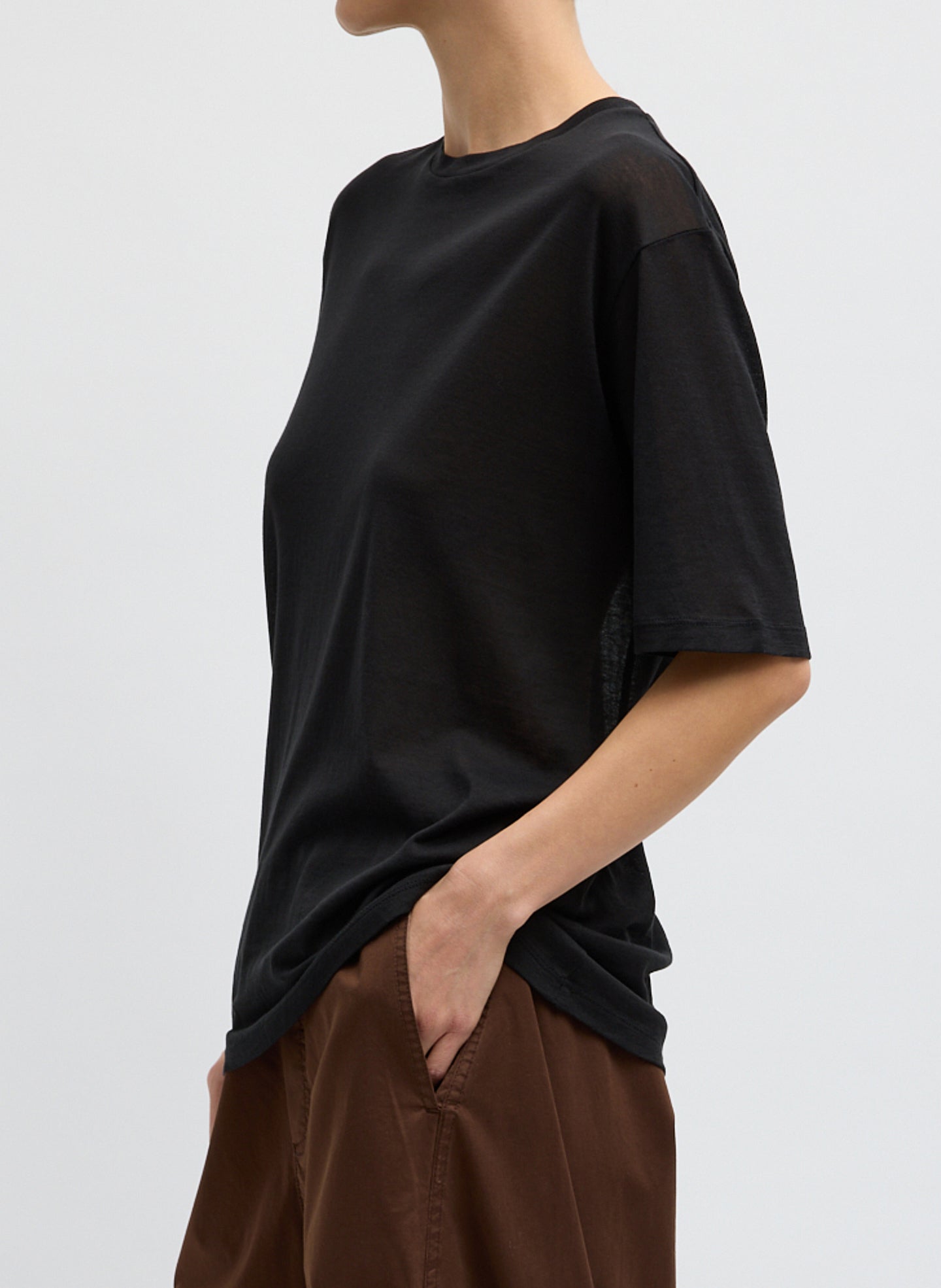Black Sheer Crepe Knit Mock Neck Unisex T-Shirt - side view on model
