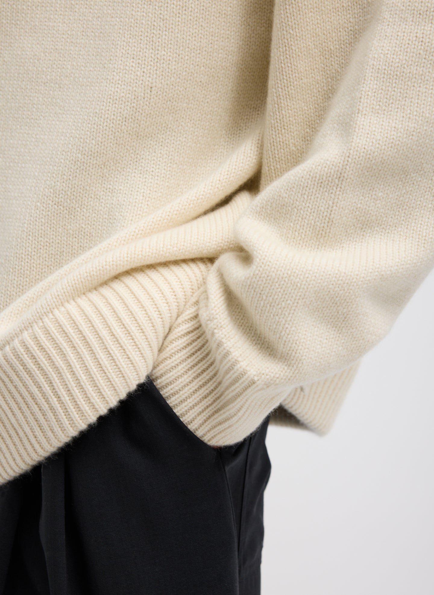 Ivory Cashmere Turtleneck Oversized Pullover Sweater - closeup of ribbed detail at sleeve and hem