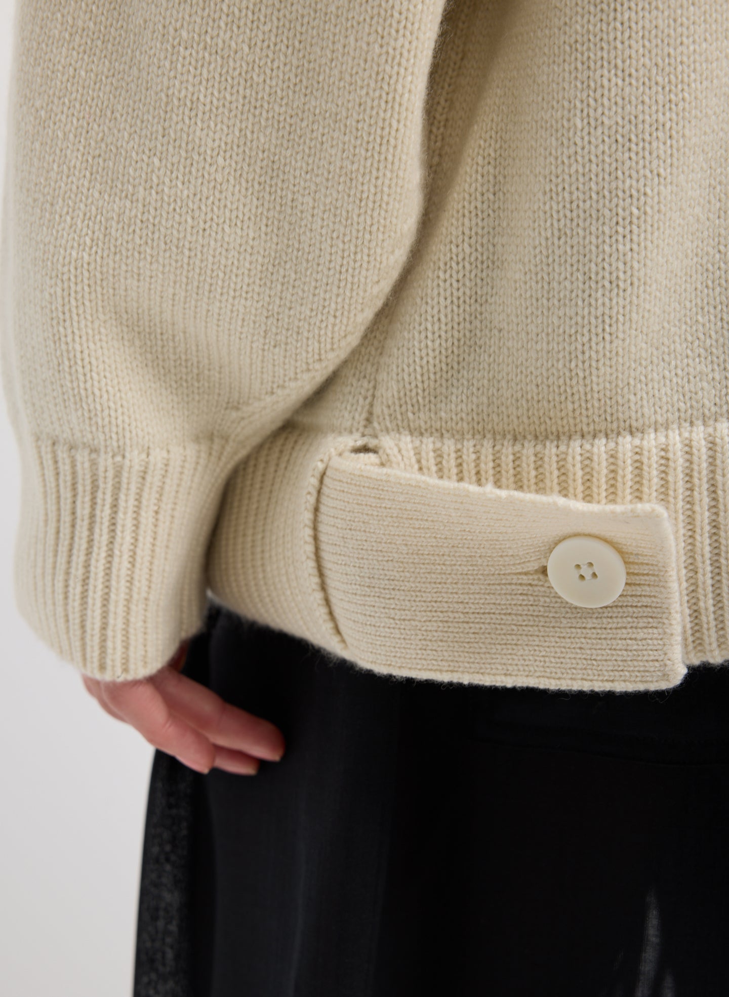 Ivory Cashmere Turtleneck Oversized Pullover Sweater - close up of side button detail at hem