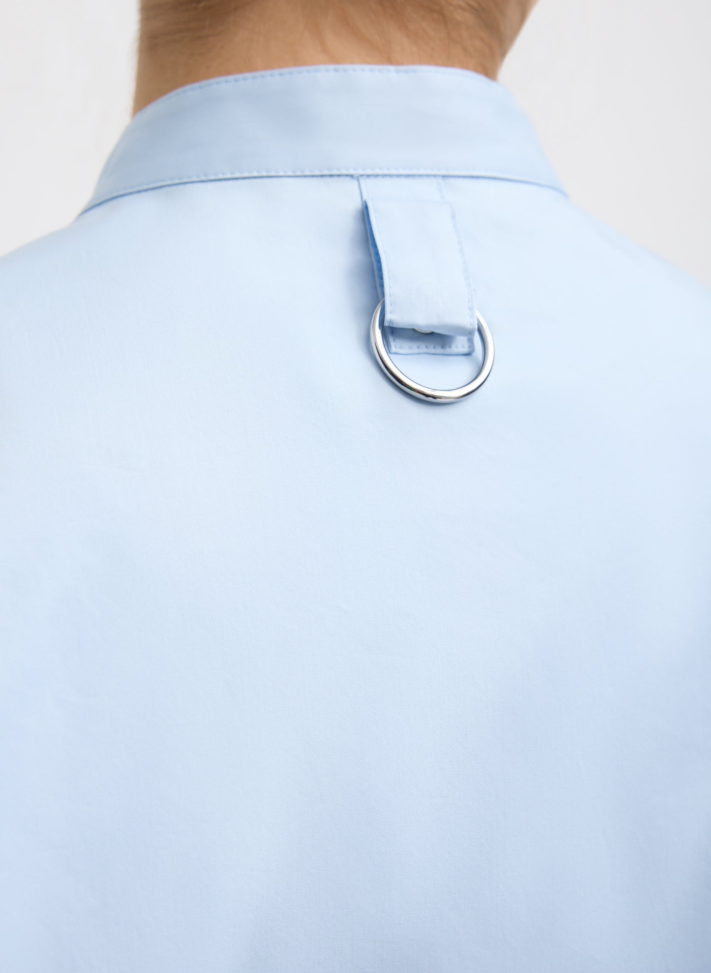 Chambray Blue Eco Poplin Tuxedo Shirt With Bib Flap - closeup of ring detail at back