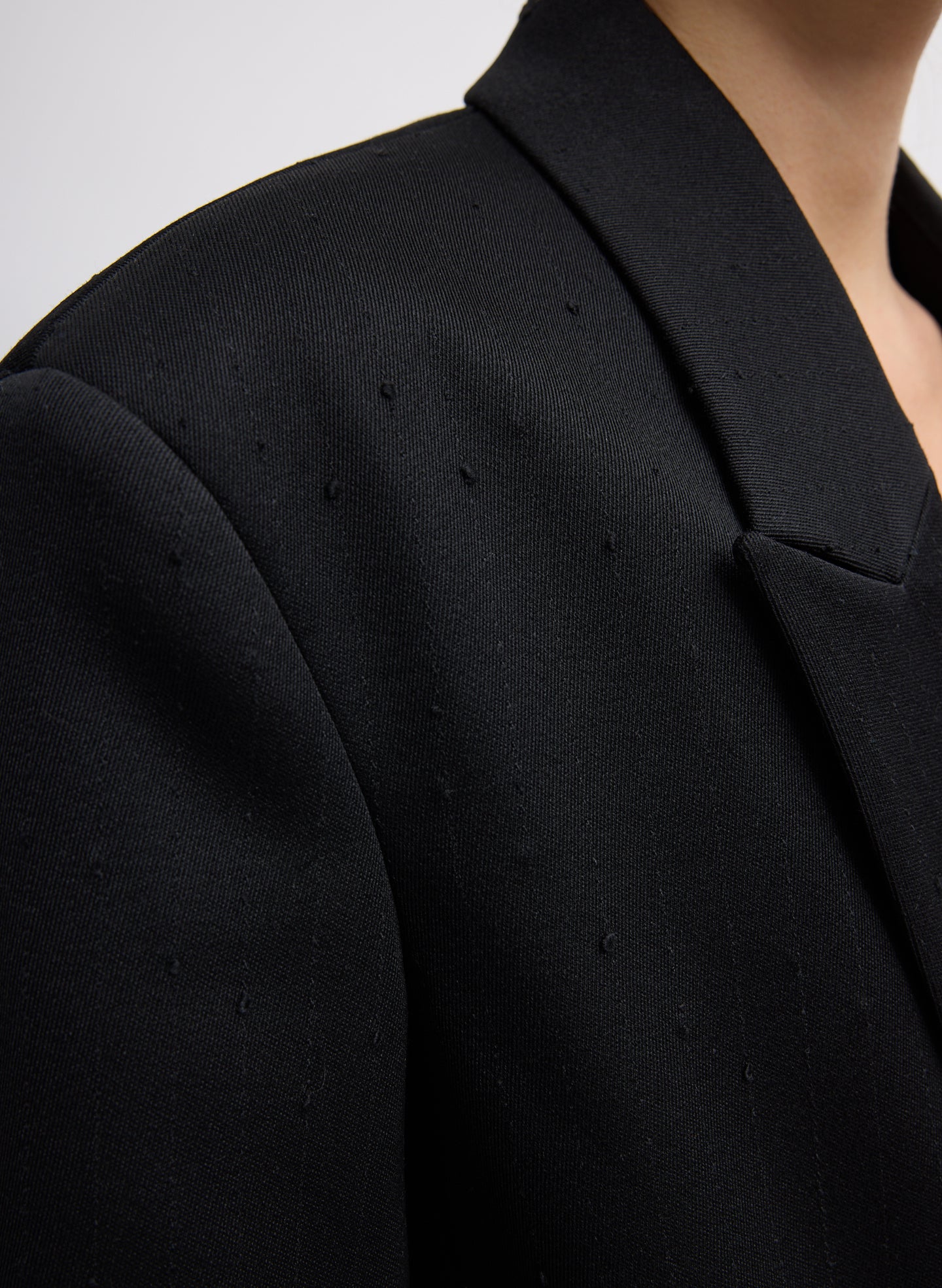 Black Refined Wool Slub Blazer With Cut Out Organza Back - closeup of wool slub fabric